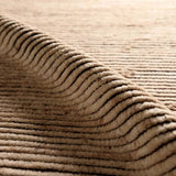 Drawing inspiration from Moroccan textiles, Alpine showcases the beauty in simplicity. Durable wool is hand-knotted onto a cotton foundation to create this high-piled accent piece. Its warm, solid tan design is finished with braided fringe trims for a touch of boho charm. Amethyst Home provides interior design, new home construction design consulting, vintage area rugs, and lighting in the Des Moines metro area.