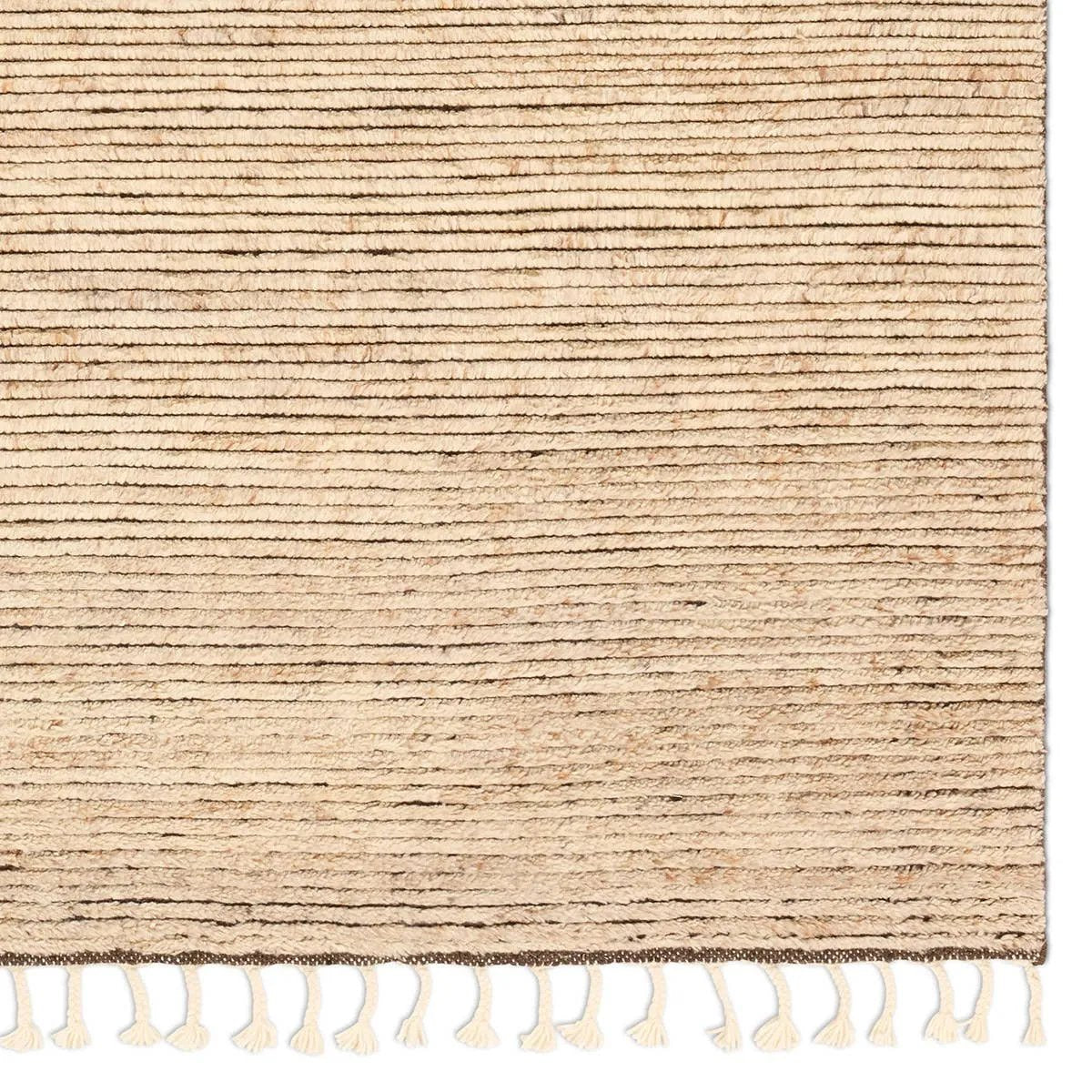 Drawing inspiration from Moroccan textiles, Alpine showcases the beauty in simplicity. Durable wool is hand-knotted onto a cotton foundation to create this high-piled accent piece. Its warm, solid tan design is finished with braided fringe trims for a touch of boho charm. Amethyst Home provides interior design, new home construction design consulting, vintage area rugs, and lighting in the Newport Beach metro area.