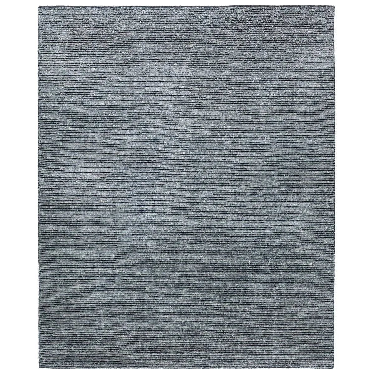 Drawing inspiration from Moroccan textiles, Alpine showcases the beauty in simplicity. Durable wool is hand-knotted onto a cotton foundation to create this high-piled accent piece. Its solid gray design instantly adds warmth and comfort to any indoor, medium-traffic setting.Hand Knotte Amethyst Home provides interior design, new home construction design consulting, vintage area rugs, and lighting in the San Diego metro area.