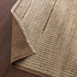 Full of texture, the handknotted Kazben Andar stuns with modern Moroccan patterns in natural hues. The Andar design delights with a taupe, tan, and brown linear pattern. A thin border adds the finishing touches to this elevated accent piece. Low, ribbed pile creates visual intrigue and grounds any contemporary space. Amethyst Home provides interior design, new home construction design consulting, vintage area rugs, and lighting in the Salt Lake City metro area.