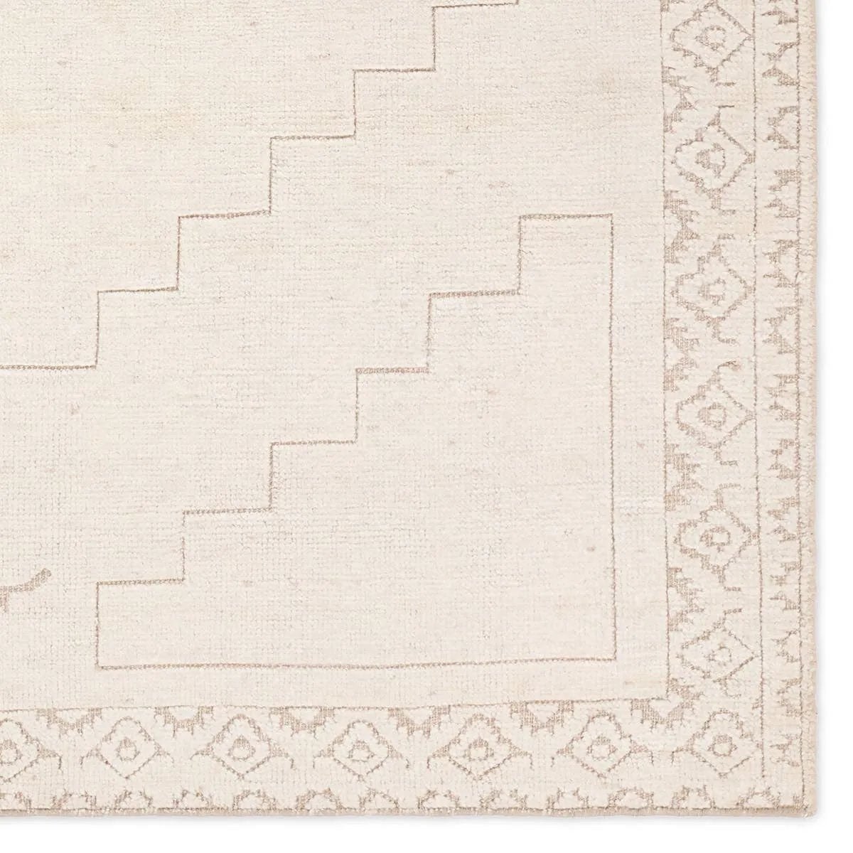 Hand carded wool, soft Tencel, and a neutral color palette define the handknotted Ashend Imbar. The Imbar rug showcases a Moroccan-inspired center medallion in a neutral, cream, taupe, and beige colorway. Geometric detailing via high and low pile establishes a thin border and provides a nod to the tribal styles of northern Africa. Amethyst Home provides interior design, new home construction design consulting, vintage area rugs, and lighting in the Washington metro area.