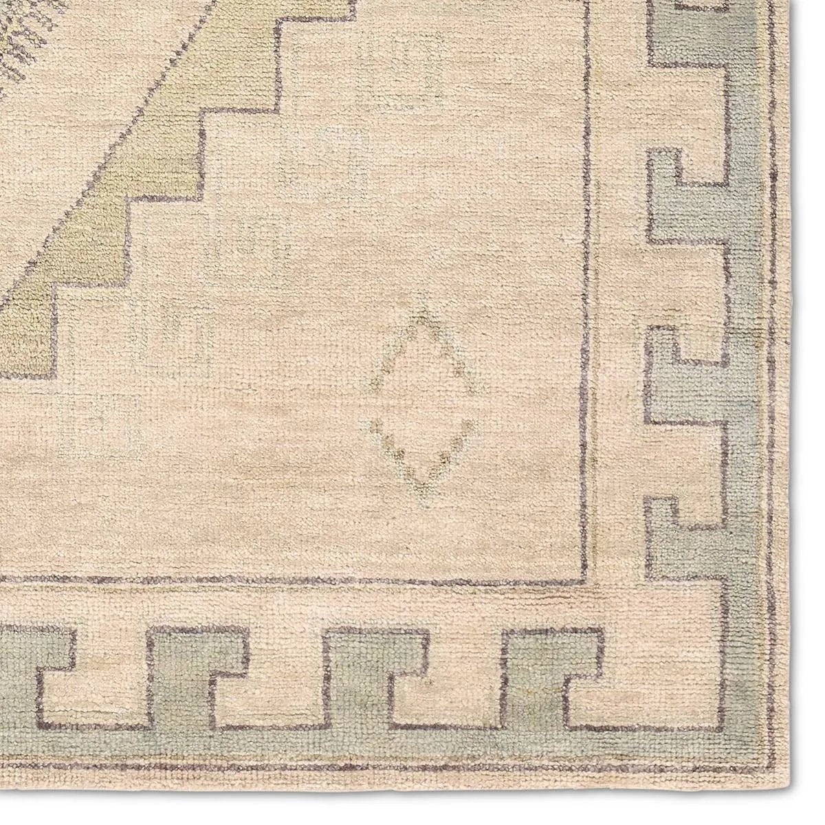 Featuring Azzurro Hand-Knotted Rug by Jaipur Living at Amethyst Home. Classic in pattern, modern in palette—the Azzurro rug offers the best of both worlds. A light green medallion motif unfolds across a soft cream backdrop, balancing timeless elegance with contemporary sensibility. Hand-carded wool lends a rich, organic texture—an ideal foundation for medium-tr. Amethyst Home provides interior design, new home construction design consulting, vintage area rugs, and lighting in the Omaha metro area.