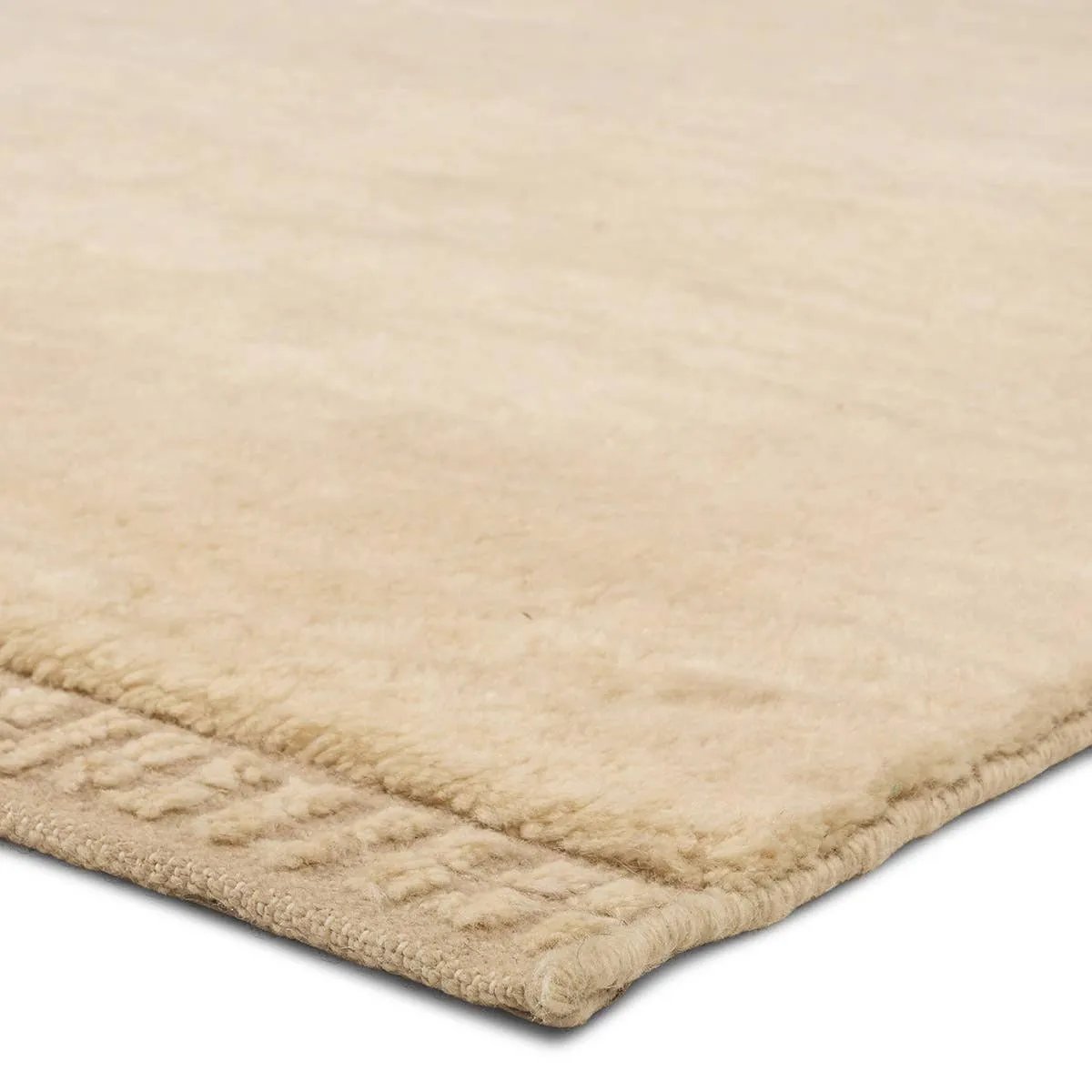 The Bekarys Colson features a shaggy texture with a remarkably soft pile that invites relaxation and warmth. Its solid neutral tones provide a versatile backdrop that enhances any decor. This plush, hand-knotted gem offers both tactile pleasure and visual appeal.Hand Knotte Amethyst Home provides interior design, new home construction design consulting, vintage area rugs, and lighting in the Washington metro area.