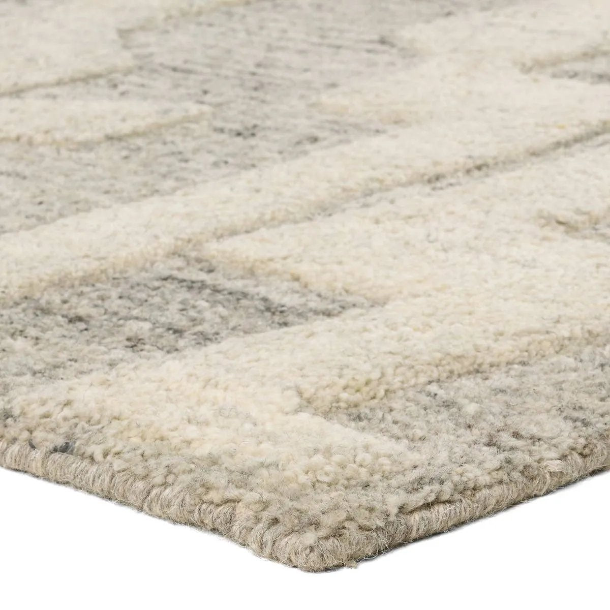 The handtufted Mallino Eminence designed by Nikki Chu infuses homes with contemporary appeal and stylishly contrasting motifs. Crafted from 100% undyed wool, the Eminence rug features a high-low texture with a soft hand and hand-embossed details. Amethyst Home provides interior design, new home construction design consulting, vintage area rugs, and lighting in the Miami metro area.