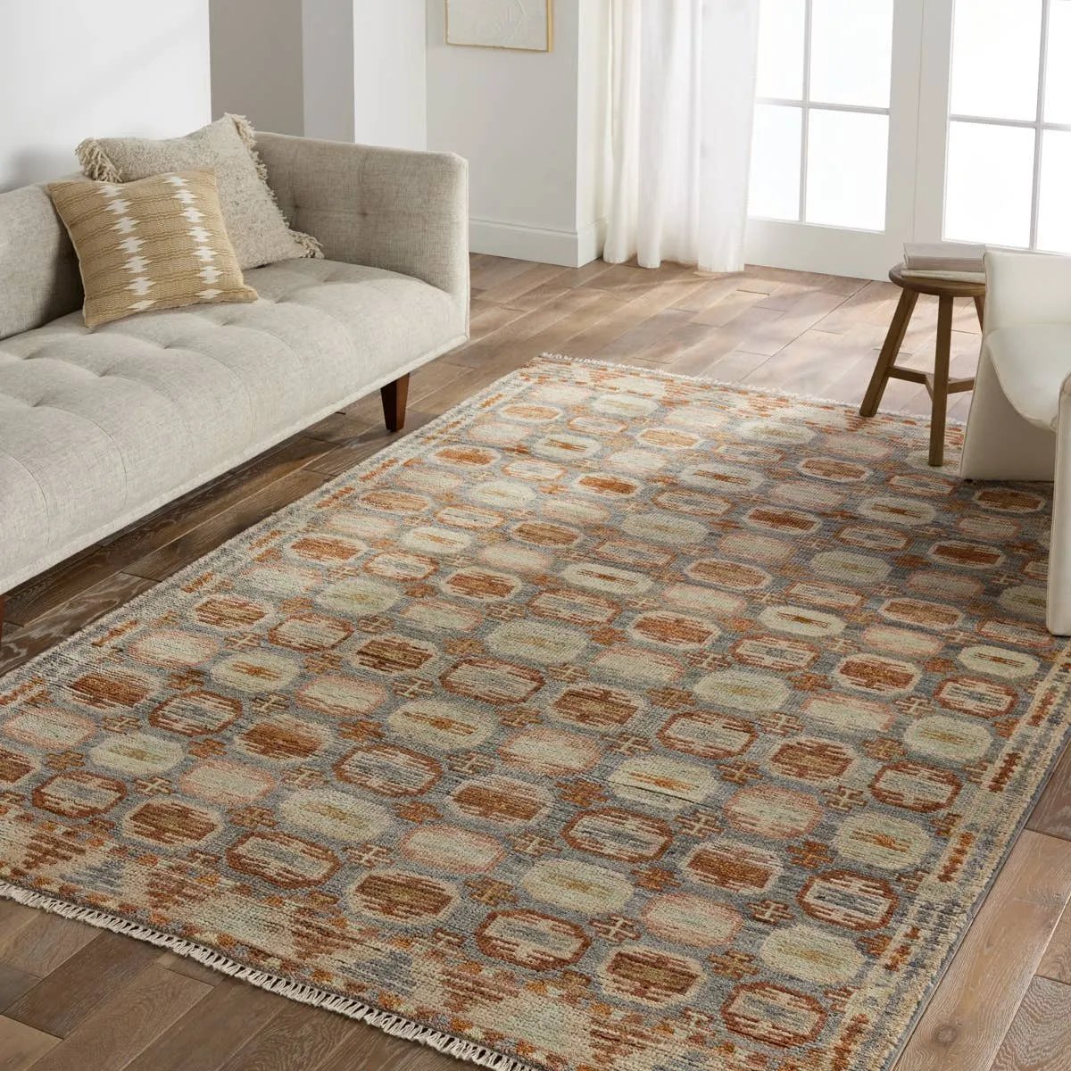 The Turkish-Killum-inspired Hazan Titale is intricately handknotted by artisans in India. Crafted with 15 knots per square inch, these durable area rugs thrive in both high and low traffic areas of the home. The Titale design showcases traditional-style miniature medallions in orange, slate, pink, light green, and cream hues. Amethyst Home provides interior design, new home construction design consulting, vintage area rugs, and lighting in the Calabasas metro area.