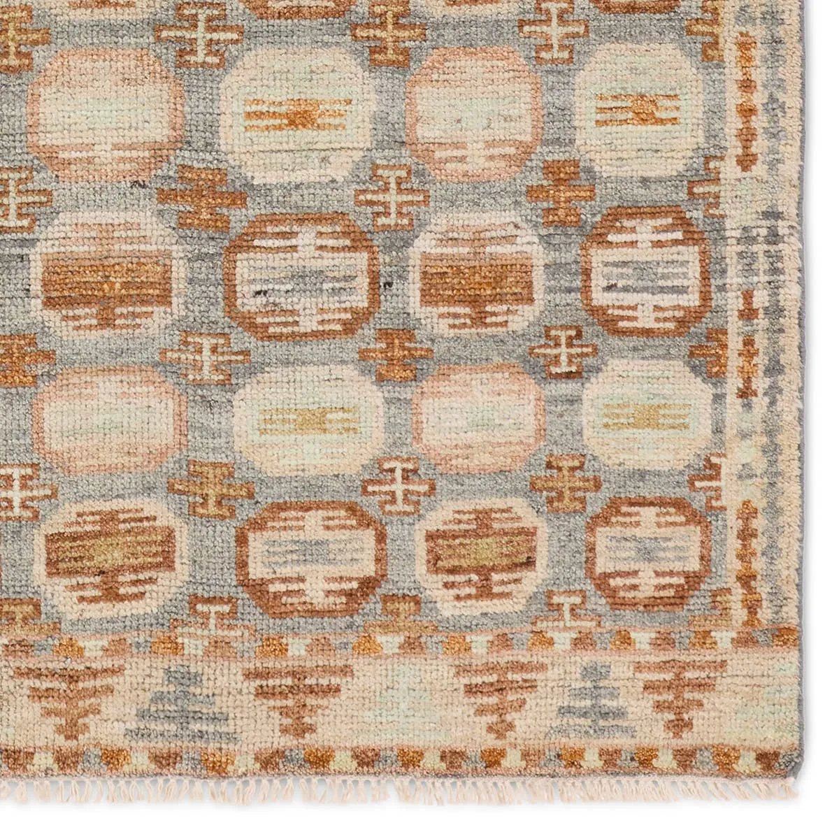 The Turkish-Killum-inspired Hazan Titale is intricately handknotted by artisans in India. Crafted with 15 knots per square inch, these durable area rugs thrive in both high and low traffic areas of the home. The Titale design showcases traditional-style miniature medallions in orange, slate, pink, light green, and cream hues. Amethyst Home provides interior design, new home construction design consulting, vintage area rugs, and lighting in the Dallas metro area.