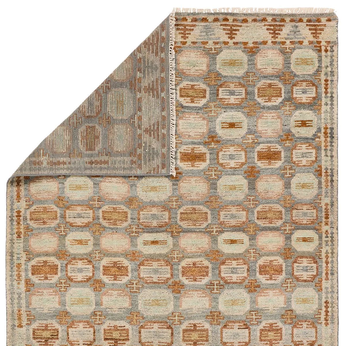 The Turkish-Killum-inspired Hazan Titale is intricately handknotted by artisans in India. Crafted with 15 knots per square inch, these durable area rugs thrive in both high and low traffic areas of the home. The Titale design showcases traditional-style miniature medallions in orange, slate, pink, light green, and cream hues. Amethyst Home provides interior design, new home construction design consulting, vintage area rugs, and lighting in the Los Angeles metro area.