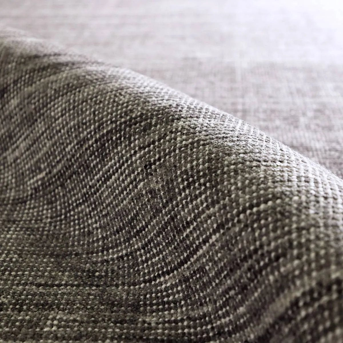 Subtle variations of gray create depth and dimension in the elegantly understated Hued rug. Handwoven with precision, its solid design offers a timeless foundation for any space—from modern to classic interiors.Handwove Amethyst Home provides interior design, new home construction design consulting, vintage area rugs, and lighting in the Tampa metro area.