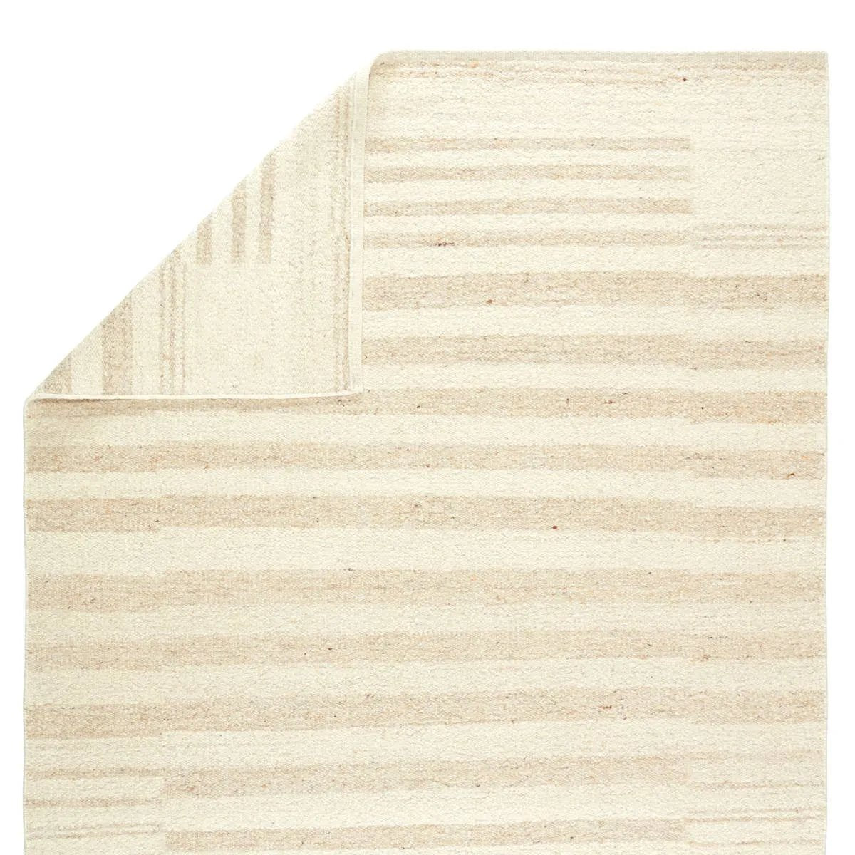The texture-rich Leona Istar offers an assortment of updated kilim looks, re-invented with the on-trend shearling style and neutral, modern palettes. The handwoven Istar rug features a globally inspired, light tan, stripe pattern on a neutral cream base. Amethyst Home provides interior design, new home construction design consulting, vintage area rugs, and lighting in the Kansas City metro area.