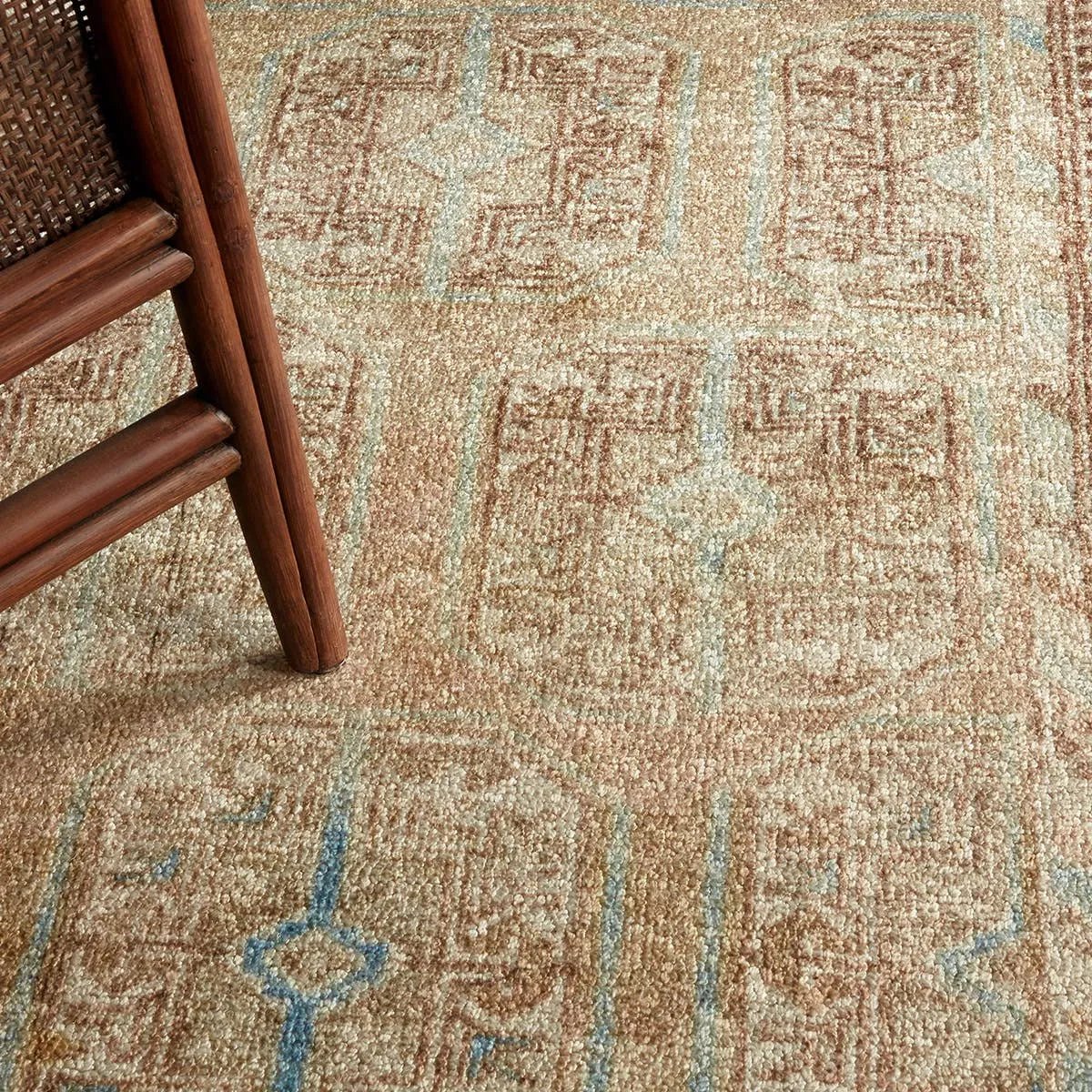 The Magnus design features a traditional pattern of small medallions set against a warm tan and beige backdrop, highlighted by subtle blue accents. Its vintage, distressed finish adds character and charm, making it feel like a treasured heirloom from the very first step.Hand Tufte Amethyst Home provides interior design, new home construction design consulting, vintage area rugs, and lighting in the Los Angeles metro area.