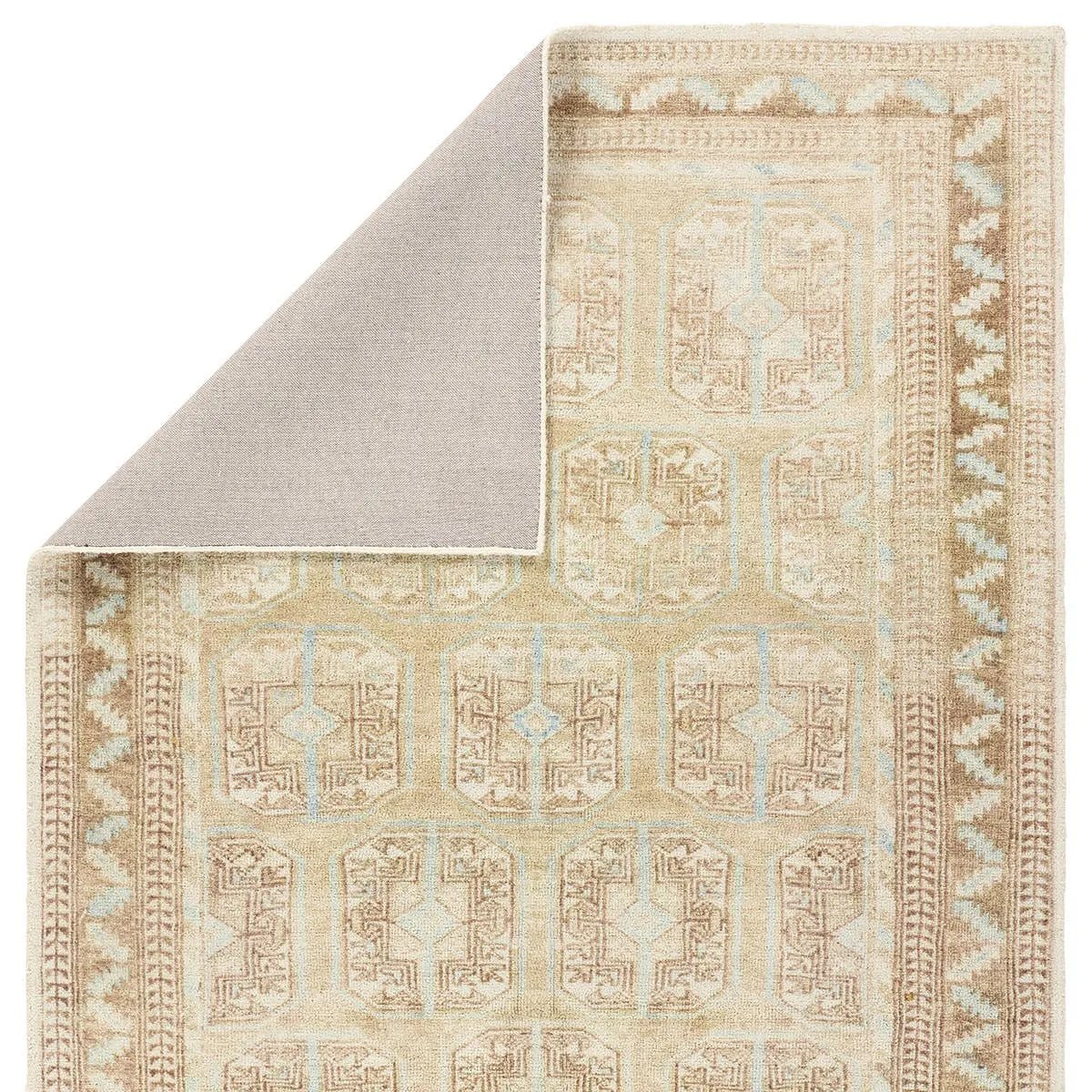 The Magnus design features a traditional pattern of small medallions set against a warm tan and beige backdrop, highlighted by subtle blue accents. Its vintage, distressed finish adds character and charm, making it feel like a treasured heirloom from the very first step.Hand Tufte Amethyst Home provides interior design, new home construction design consulting, vintage area rugs, and lighting in the Omaha metro area.