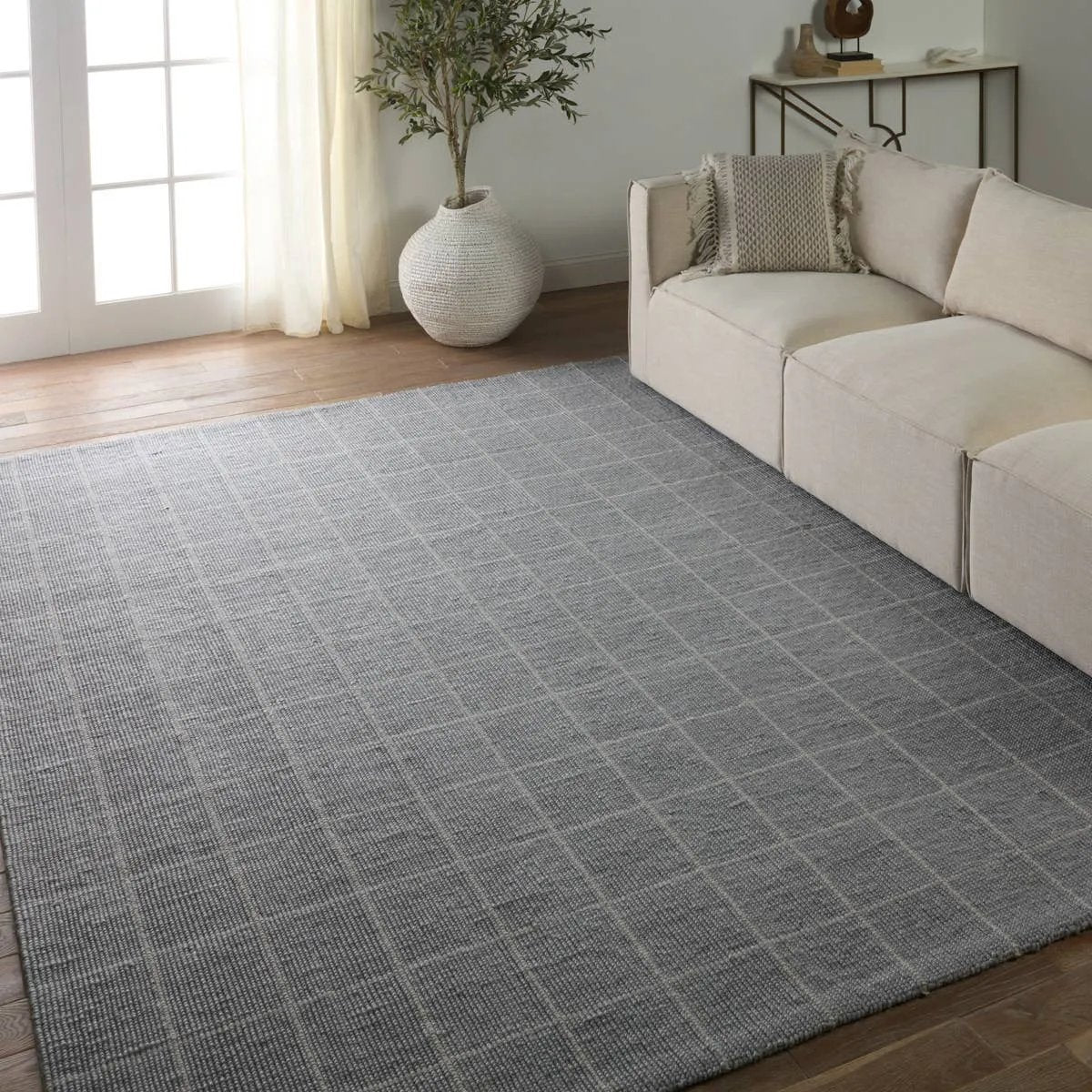 Featuring Oxford  Club Rug by Jaipur Living at Amethyst Home. Elegant and casual in the same moment, the Oxford Club by Barclay Butera introduces handwoven accents to an array of spaces. The natural, undyed yarns complement a range of palettes and styles, perfectly paired for modern and traditional homes alike. The Club design features a grid pattern in an ind. Amethyst Home provides interior design, new home construction design consulting, vintage area rugs, and lighting in the Dallas metro area.