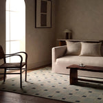The Quinlan design reinvents timeless geometric patterns, fusing classic charm with a modern edge. Soft beige tones, punctuated by a blue accent, elevate any mid-century modern space. Handcrafted from naturally stain-resistant wool, this rug handles medium-traffic areas, kids, and pets with ease. Amethyst Home provides interior design, new home construction design consulting, vintage area rugs, and lighting in the Alpharetta metro area.