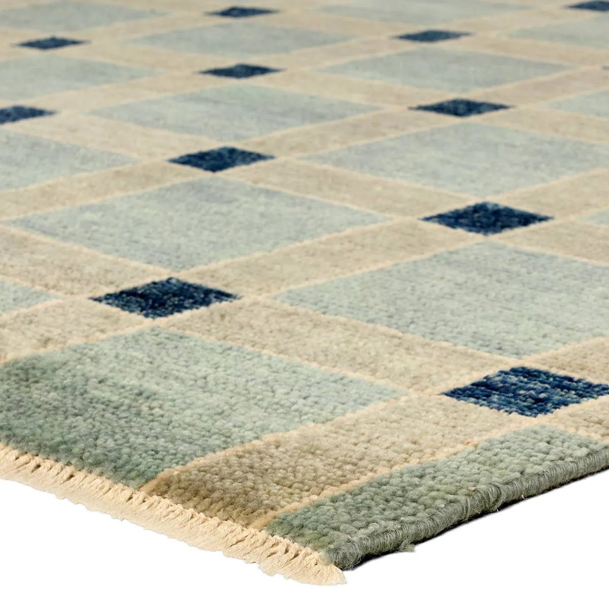 The Quinlan design reinvents timeless geometric patterns, fusing classic charm with a modern edge. Soft beige tones, punctuated by a blue accent, elevate any mid-century modern space. Handcrafted from naturally stain-resistant wool, this rug handles medium-traffic areas, kids, and pets with ease. Amethyst Home provides interior design, new home construction design consulting, vintage area rugs, and lighting in the Austin metro area.