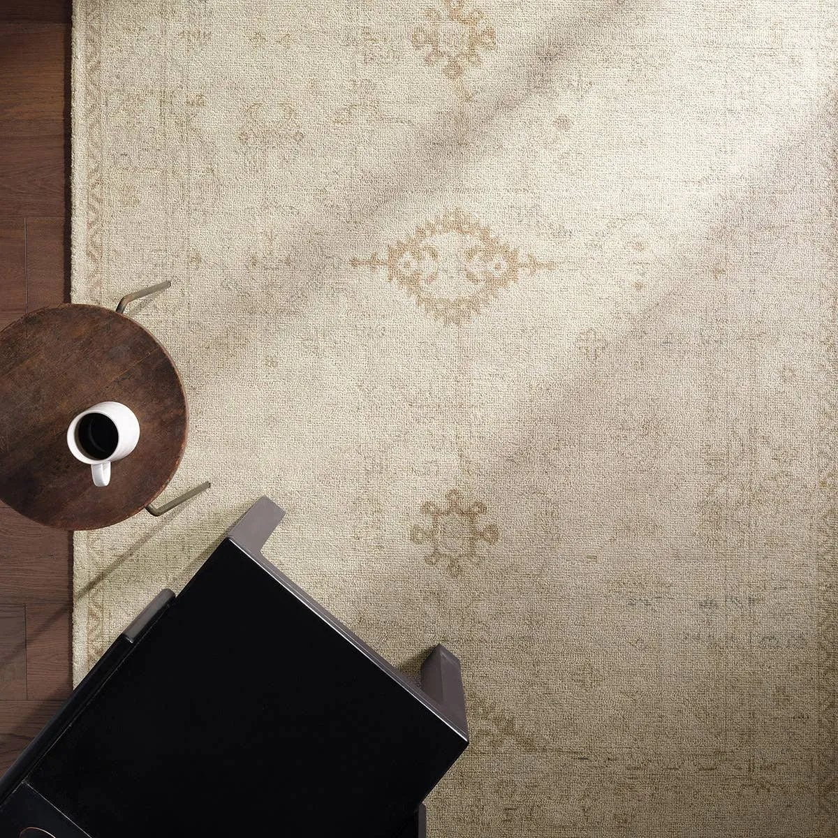 The Saffron design features a traditional pattern of small medallions, set against a warm tan and beige backdrop with subtle tan accents. Its vintage, distressed look adds character and charm, making it feel like a cherished heirloom from the very first step.Hand Tufte Amethyst Home provides interior design, new home construction design consulting, vintage area rugs, and lighting in the Houston metro area.