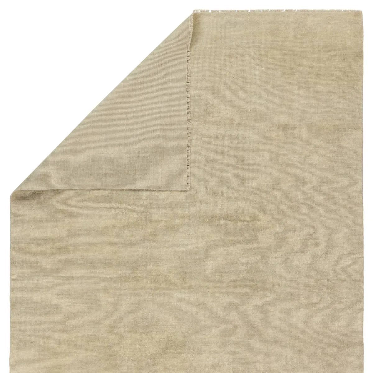 Featuring Saga Origin Hand-Knotted Rug by Jaipur Living at Amethyst Home. The sophisticated Saga Origin lends balance and a relaxed, grounding vibe to modern interiors. The Origin area rug anchors a space with a solid, subtly striated design in a neutral, ivory colorway. Hand knotted by skilled artisans, this durable wool accent marries simplicity and luxury w. Amethyst Home provides interior design, new home construction design consulting, vintage area rugs, and lighting in the Boston metro area.