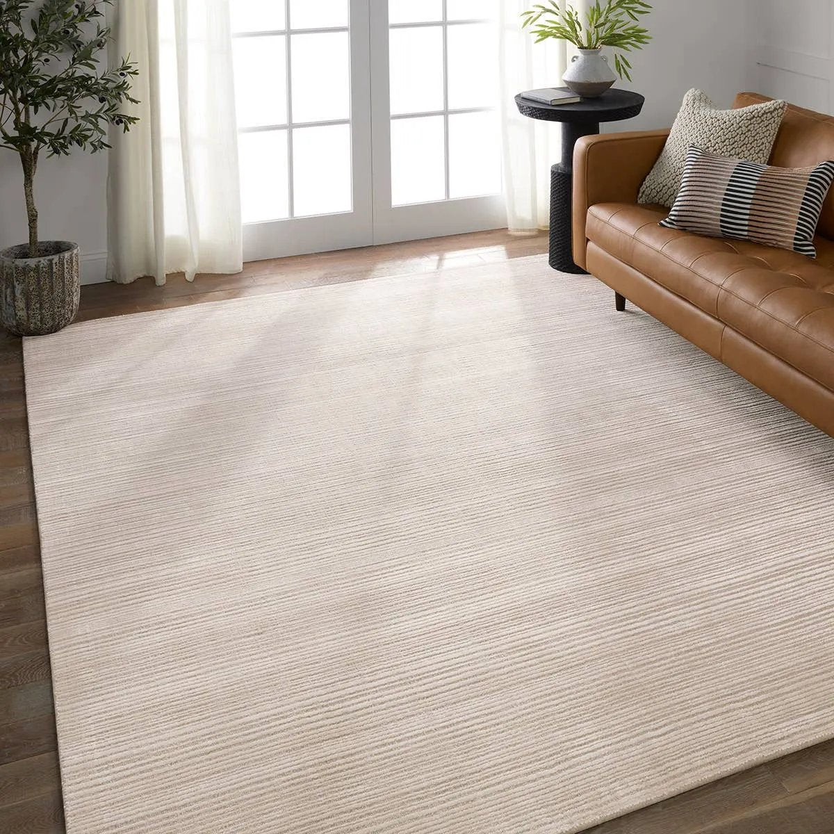 Featuring Second Sunset Gradient Rug by Jaipur Living at Amethyst Home. The easy-to-decorate, earthy tones of the Second Sunset Gradient prove that simplicity can sometimes be striking. The Gradient rug is hand loomed of durable wool and jasmine for a sumptuous and inviting hand. The variation in ivory and cream colors of this lustrous rug creates stun. Amethyst Home provides interior design, new home construction design consulting, vintage area rugs, and lighting in the Salt Lake City metro area.