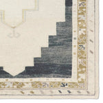Featuring Stellar Rug by Jaipur Living at Amethyst Home. The Stellar design merges timeless tradition with a vintage-inspired aesthetic. Featuring a striking central medallion, this rug is set against an elegant beige and black backdrop, accented by rich green detailing. Its classic pattern, paired with a gently distressed finish, creates an heirloom quali. Amethyst Home provides interior design, new home construction design consulting, vintage area rugs, and lighting in the Washington metro area.