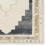 Featuring Stellar Rug by Jaipur Living at Amethyst Home. The Stellar design merges timeless tradition with a vintage-inspired aesthetic. Featuring a striking central medallion, this rug is set against an elegant beige and black backdrop, accented by rich green detailing. Its classic pattern, paired with a gently distressed finish, creates an heirloom quali. Amethyst Home provides interior design, new home construction design consulting, vintage area rugs, and lighting in the Washington metro area.