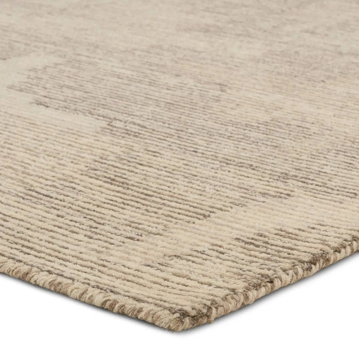 The hand-tufted Labyrinth Tenley presents abstract designs crafted from plush wool with a cut and looped pile, creating a rich, tactile texture. The Tenley design showcases a bold, geometric pattern with a modern brutalist influence in shades of gray and taupe, effortlessly adding depth and sophistication.Hand Tufte Amethyst Home provides interior design, new home construction design consulting, vintage area rugs, and lighting in the Boston metro area.