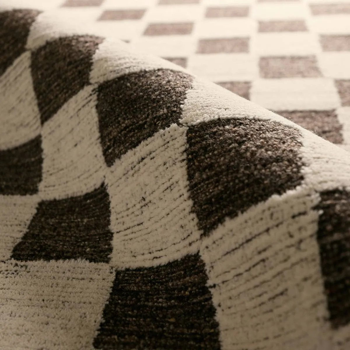 The Tijara design checks all the boxes. Handmade of 100% all-natural, undyed wool, this rug enjoys an understated elegance that is satisfying in its simplicity. Intricate overtufting brings a dynamic high-low pile to life, adding dimension. Easy to care for, durable, and undoubtedly modern, it exudes a quiet strength.Hand Tufte Amethyst Home provides interior design, new home construction design consulting, vintage area rugs, and lighting in the Tampa metro area.