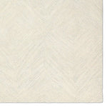 The handtufted Labyrinth Collection features abstract designs crafted from plush wool with a cut-and-looped pile, creating a rich, tactile texture. The Tulsi design showcases a bold, geometric pattern with modern Brutalist influence in varying shades of gray and taupe, adding depth and sophistication with its subtle tonal dimension.Hand Tufte Amethyst Home provides interior design, new home construction design consulting, vintage area rugs, and lighting in the Tampa metro area.