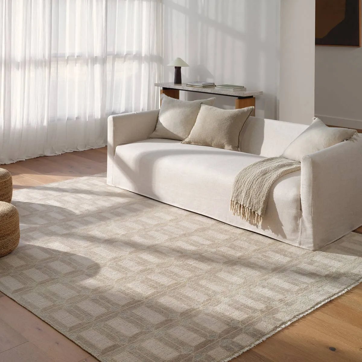 The Vaila design reinvents timeless geometric grid patterns, fusing classic charm with a modern edge. Soft beige tones elevate any mid-century modern space, while naturally stain-resistant wool handles medium-traffic areas, kids, and pets with ease. A durable yet stylish foundation, this piece is designed to stand the test of time.Hand Knotte Amethyst Home provides interior design, new home construction design consulting, vintage area rugs, and lighting in the Charlotte metro area.