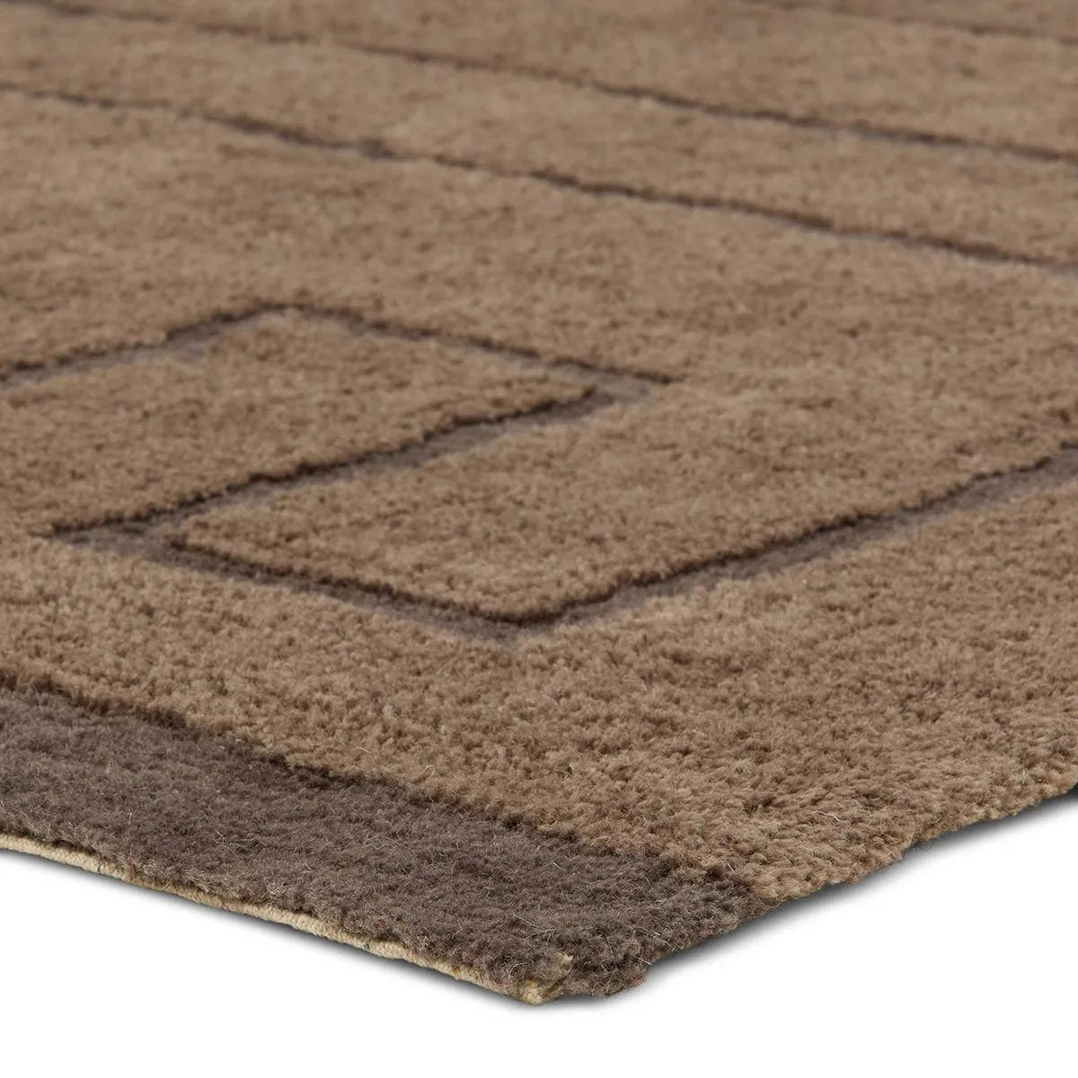 Featuring Ziyan Rug by Jaipur Living at Amethyst Home. With its neutral brown hue and modern geometric pattern, the Aibel Ziyan adds a contemporary touch to your space. Hand-tufted from washable wool and offering plush comfort, it’s ideal for kids’ rooms or any area where spills are bound to happen. Here’s a stylish, worry-free solution that can handle t. Amethyst Home provides interior design, new home construction design consulting, vintage area rugs, and lighting in the Laguna Beach metro area.