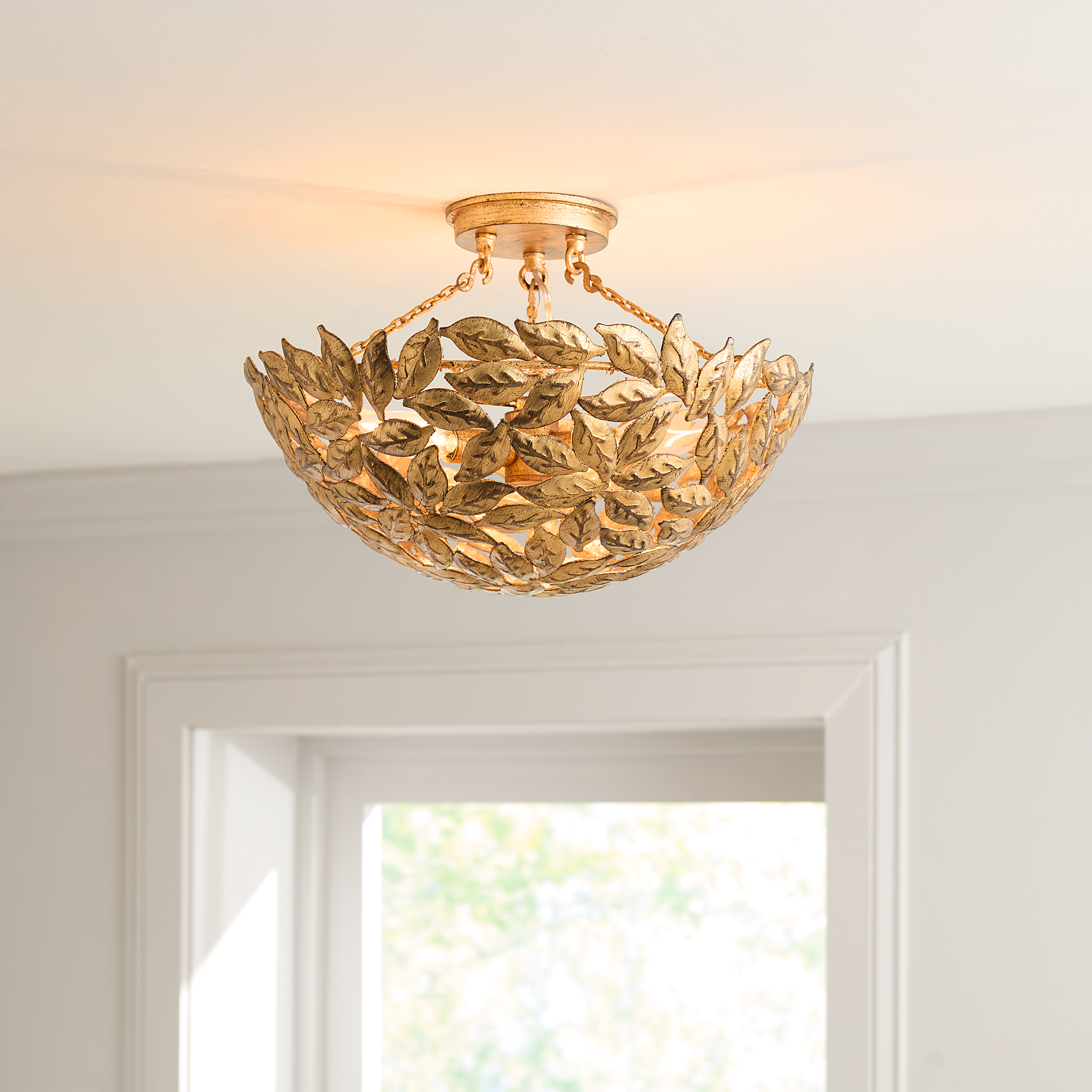 Featuring Kelan Semi Flush Mount Antique Gild by Visual Comfort at Amethyst Home. The elegant forms of motif leaves give this radiant chandelier a vintage-inspired aesthetic that can instantly elevate any interior with classic appeal.
Overall Dimensions: 16" L x 16" W x 10.125" H. Amethyst Home provides interior design, new construction, custom furniture, and area rugs in the Austin metro area