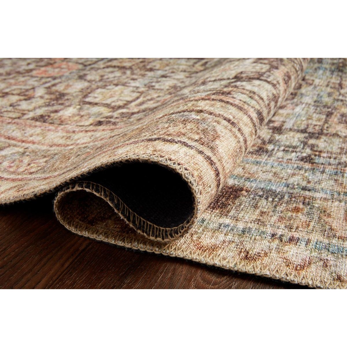 The Loren Charcoal / Multi Area Rug, or LQ17, offers vintage hand-knotted looks at an affordable price. This power loomed rug is perfect for living rooms, dining rooms, or other high traffic areas. These printed designs provide a textured effect by portraying every single individual knot on a soft polyester base.