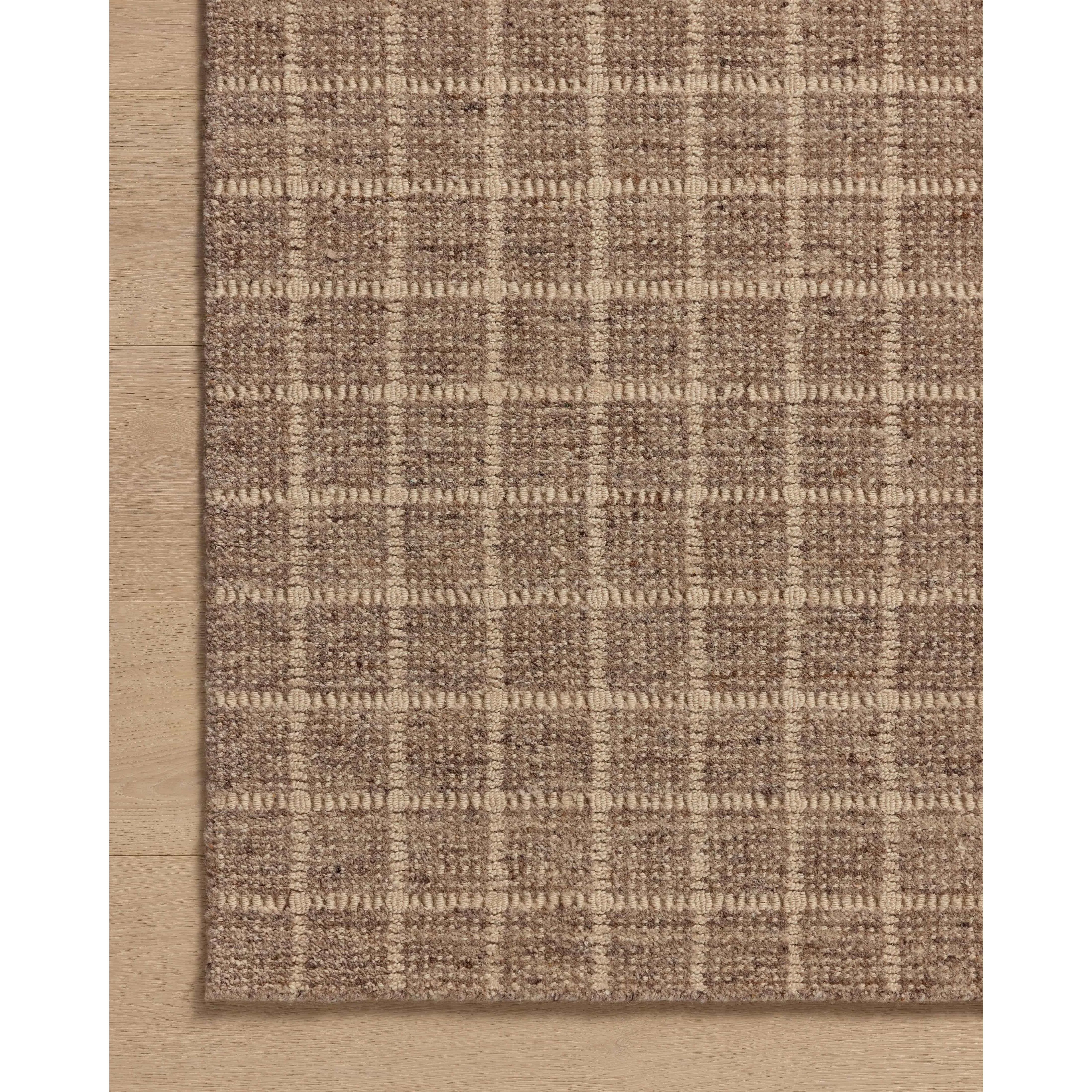 The Cedar Collection by Amber Lewis x Loloi is a hand-loomed area rug with a clean gridded design in contrasting ivory. The rugs blended wool and cotton pile is substantial and soft, with flecked tones that add depth to the neutral palette. Amethyst Home provides interior design, new home construction design consulting, vintage area rugs, and lighting in the Seattle metro area.
