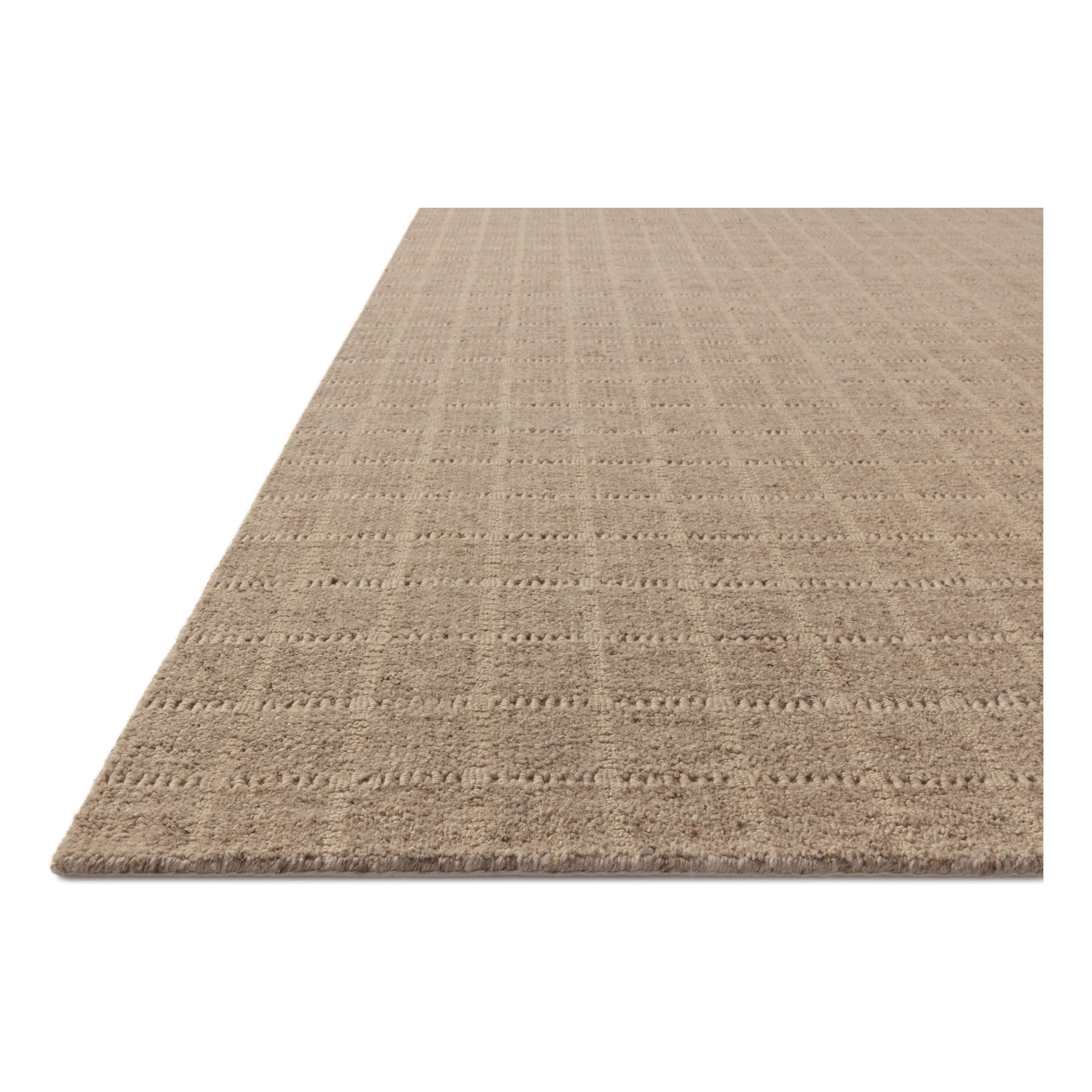 The Cedar Collection by Amber Lewis x Loloi is a hand-loomed area rug with a clean gridded design in contrasting ivory. The rugs blended wool and cotton pile is substantial and soft, with flecked tones that add depth to the neutral palette. Amethyst Home provides interior design, new home construction design consulting, vintage area rugs, and lighting in the Calabasas metro area.
