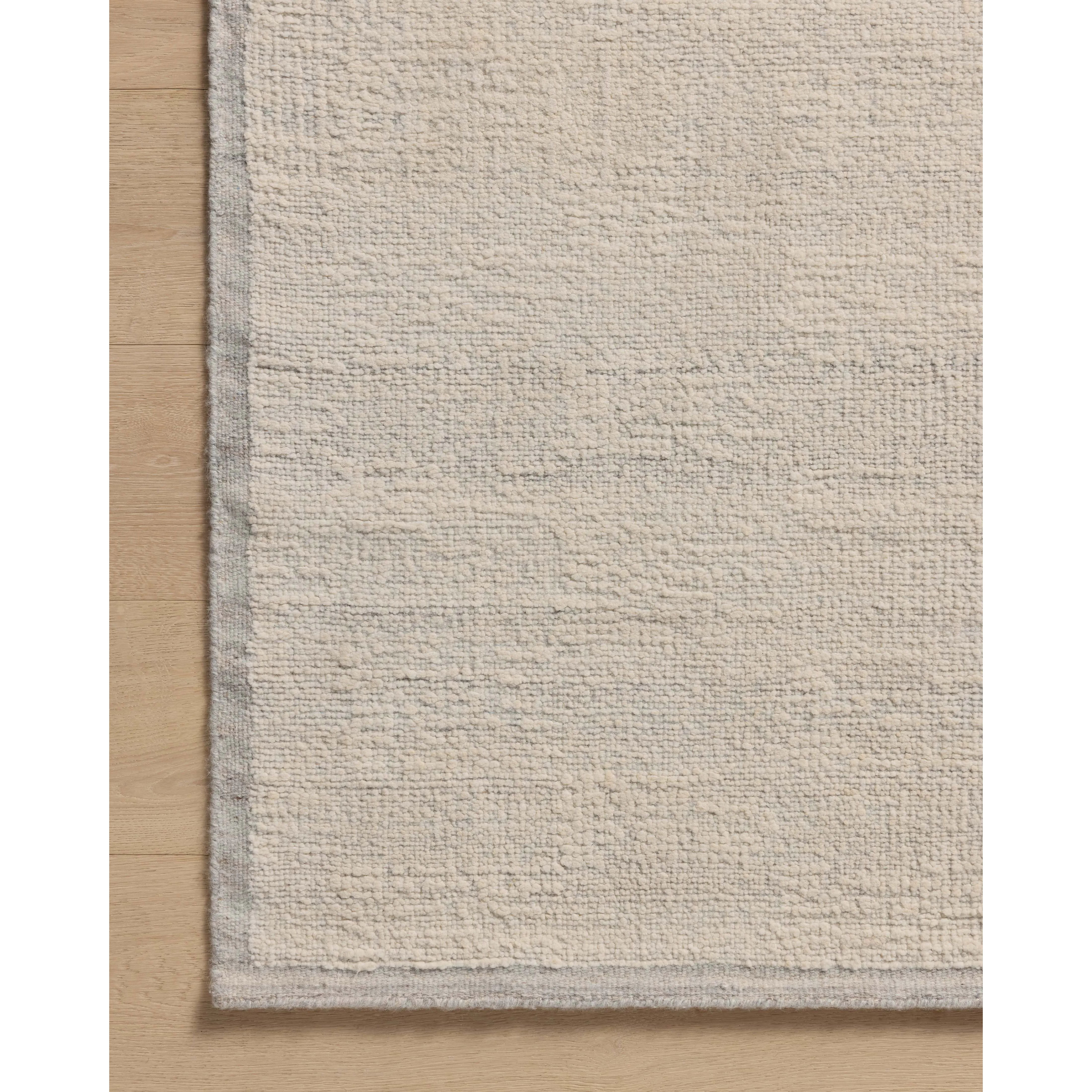 Featuring Amber Lewis x Loloi Dakota Mist / Ivory Rug by Loloi at Amethyst Home. The Dakota Collection by Amber Lewis x Loloi is a flatweave-style area rug with a muted checkerboard pattern framed with a deeper-toned border. The rug is hand-woven of wool and cotton for a durable, natural warmth in living rooms, bedrooms, and more. This collection is handmad. Amethyst Home provides interior design, new home construction design consulting, vintage area rugs, and lighting in the San Diego metro area.