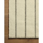 The Harlan Collection by Amber Lewis x Loloi is a classic striped flatweave area rug in the interior designer’s signature warm, earthy tones. The rug has a chunky wool pile with whipstitch borders that add character and natural texture to living rooms, bedrooms, and other well-loved areas of the home. Amethyst Home provides interior design, new home construction design consulting, vintage area rugs, and lighting in the Tampa metro area.