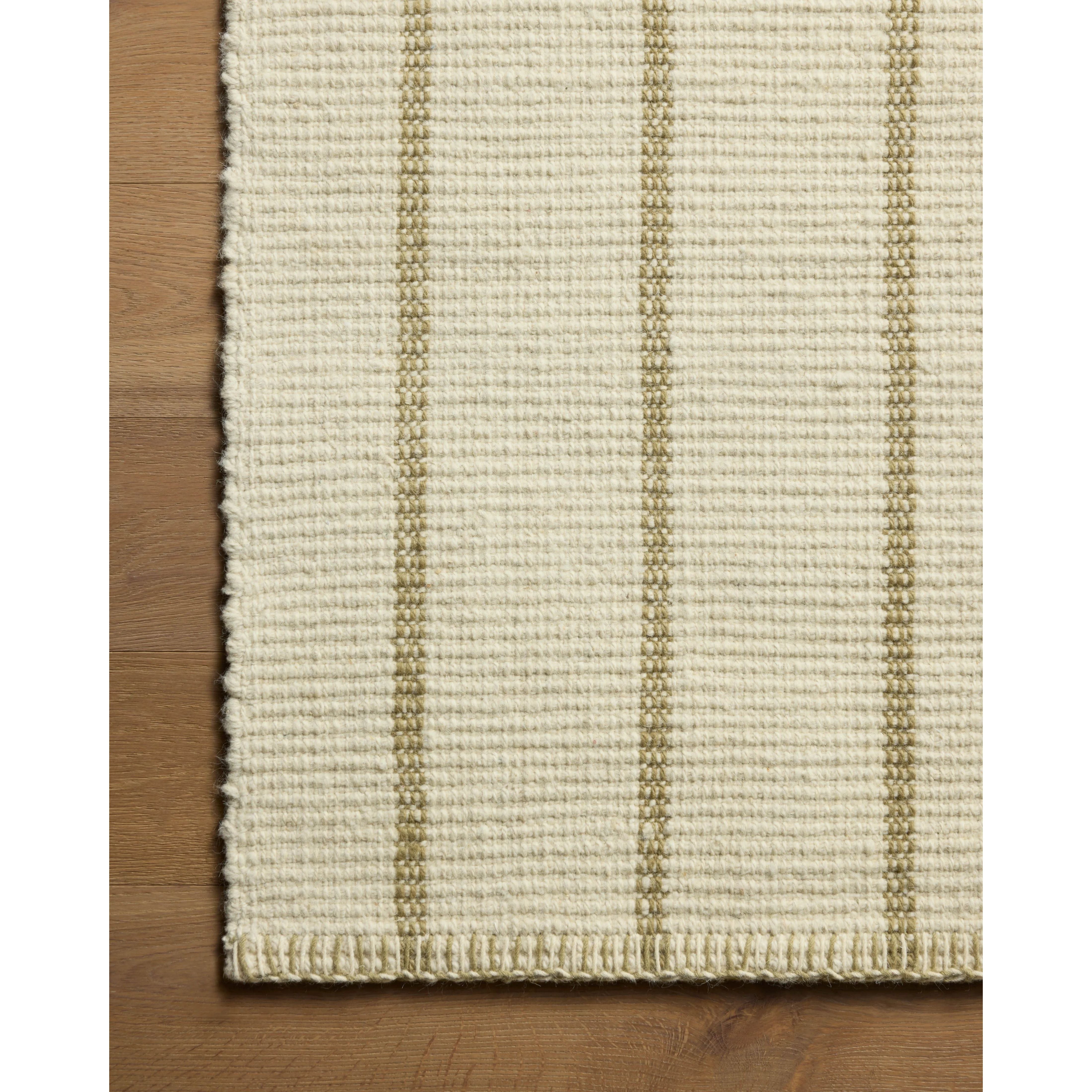 The Harlan Collection by Amber Lewis x Loloi is a classic striped flatweave area rug in the interior designer’s signature warm, earthy tones. The rug has a chunky wool pile with whipstitch borders that add character and natural texture to living rooms, bedrooms, and other well-loved areas of the home. Amethyst Home provides interior design, new home construction design consulting, vintage area rugs, and lighting in the Washington metro area.