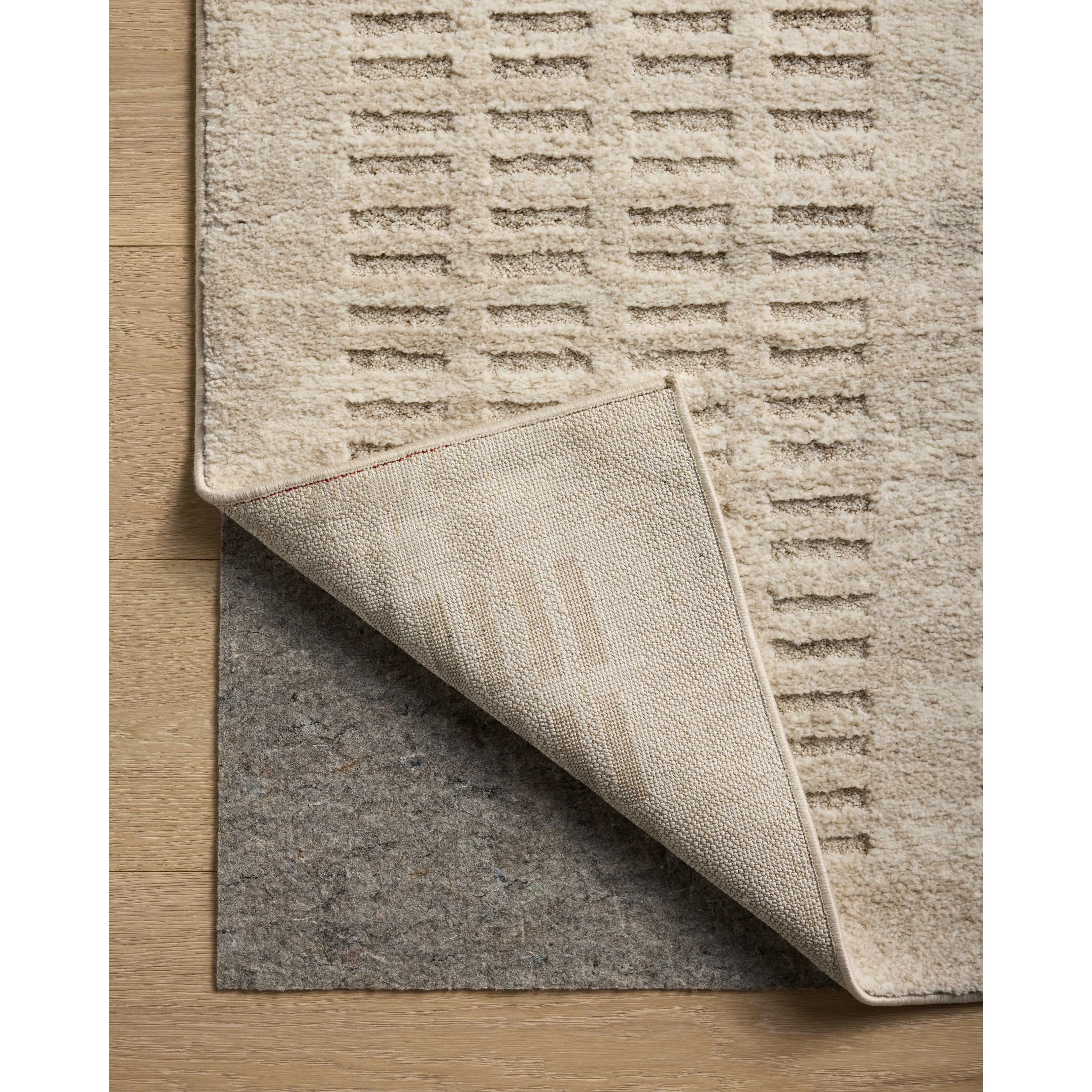The Monty Collection by Amber Lewis x Loloi is a modern interpretation of richly piled Moroccan rugs in a refreshingly neutral color palette. The rugs abstract designs create a high-low texture in the pile for feet to sink into. Amethyst Home provides interior design, new home construction design consulting, vintage area rugs, and lighting in the Newport Beach metro area.