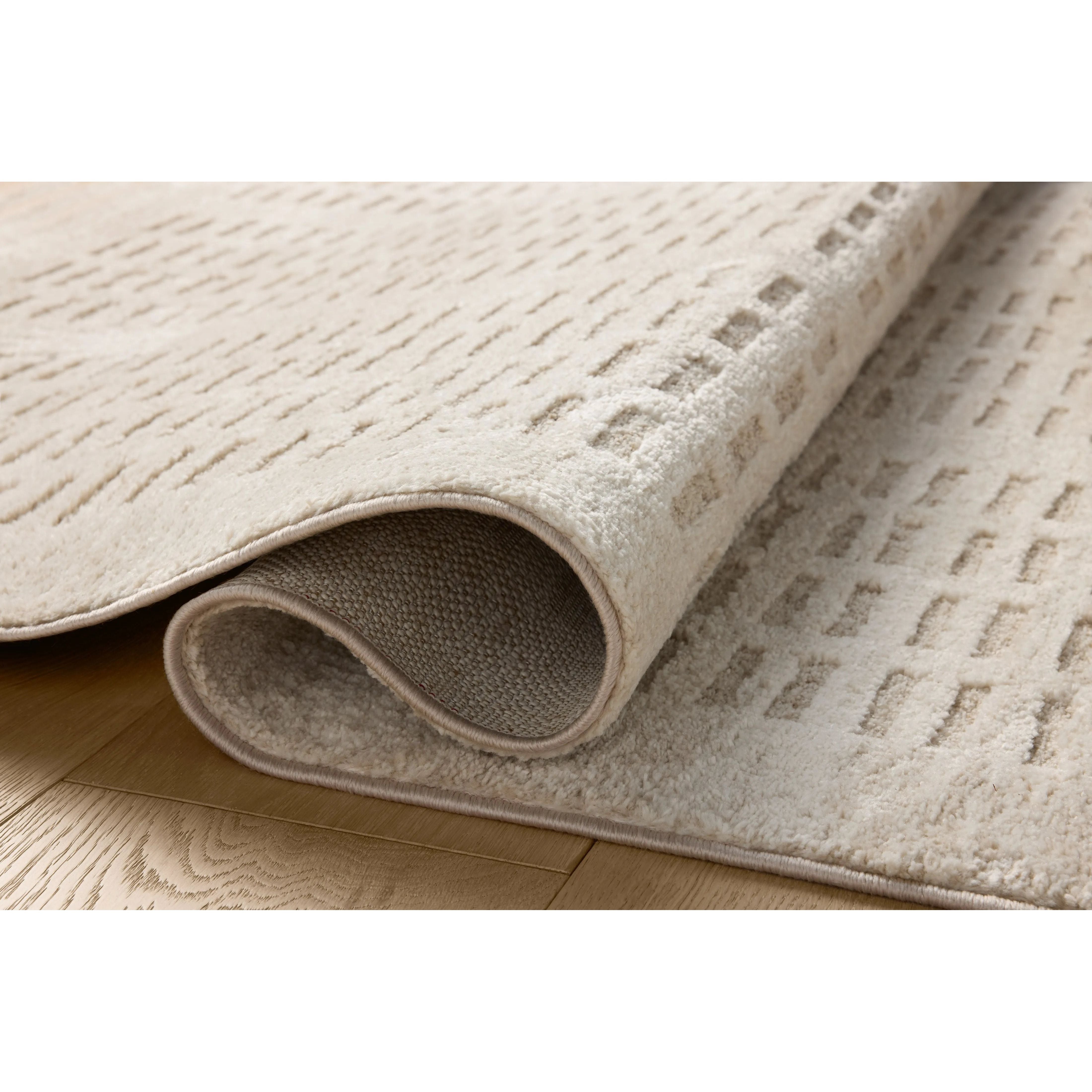 The Monty Collection by Amber Lewis x Loloi is a modern interpretation of richly piled Moroccan rugs in a refreshingly neutral color palette. The rugs abstract designs create a high-low texture in the pile for feet to sink into. Amethyst Home provides interior design, new home construction design consulting, vintage area rugs, and lighting in the Tampa metro area.