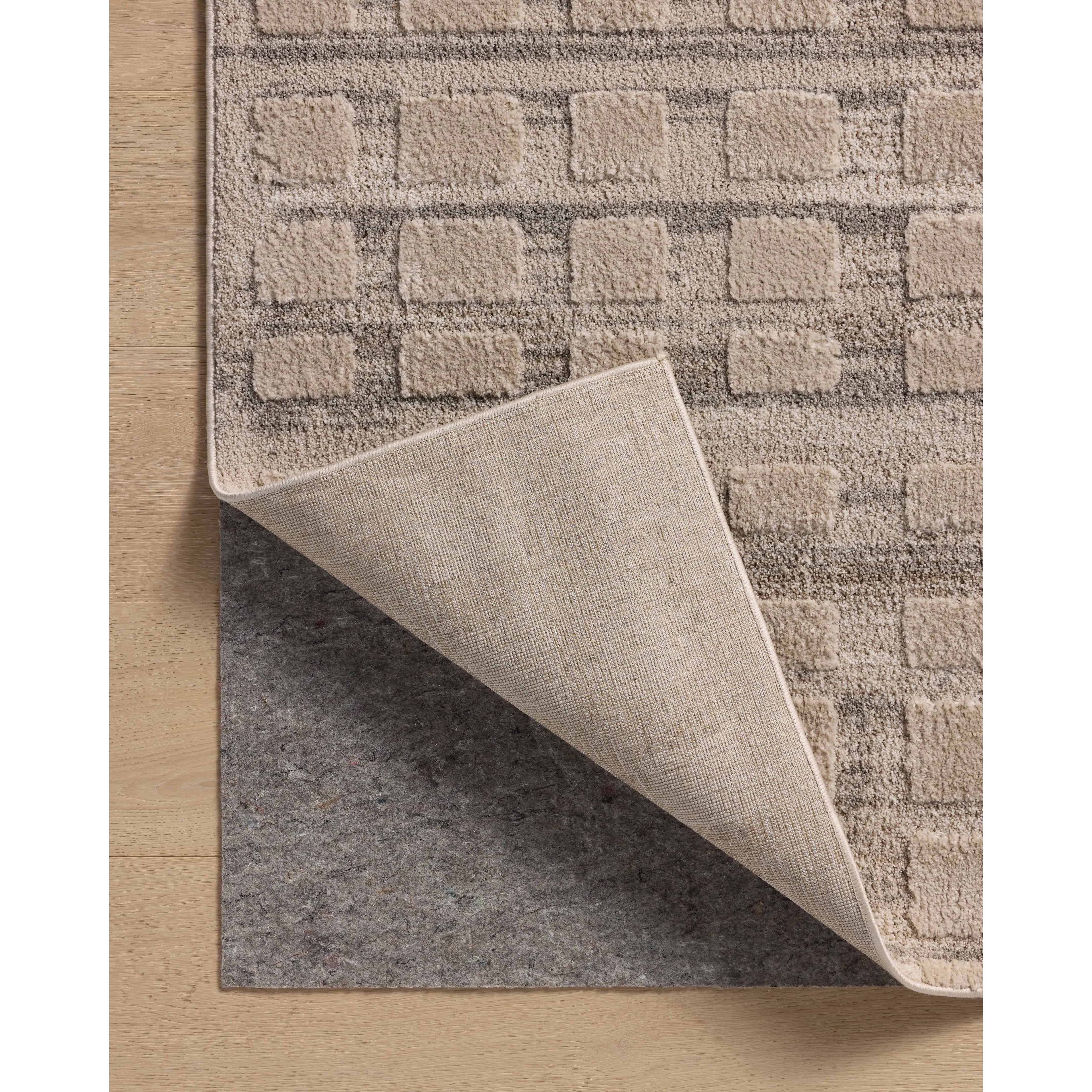 The Monty Collection by Amber Lewis x Loloi is a modern interpretation of richly piled Moroccan rugs in a refreshingly neutral color palette. The rugs abstract designs create a high-low texture in the pile for feet to sink into. Amethyst Home provides interior design, new home construction design consulting, vintage area rugs, and lighting in the Boston metro area.