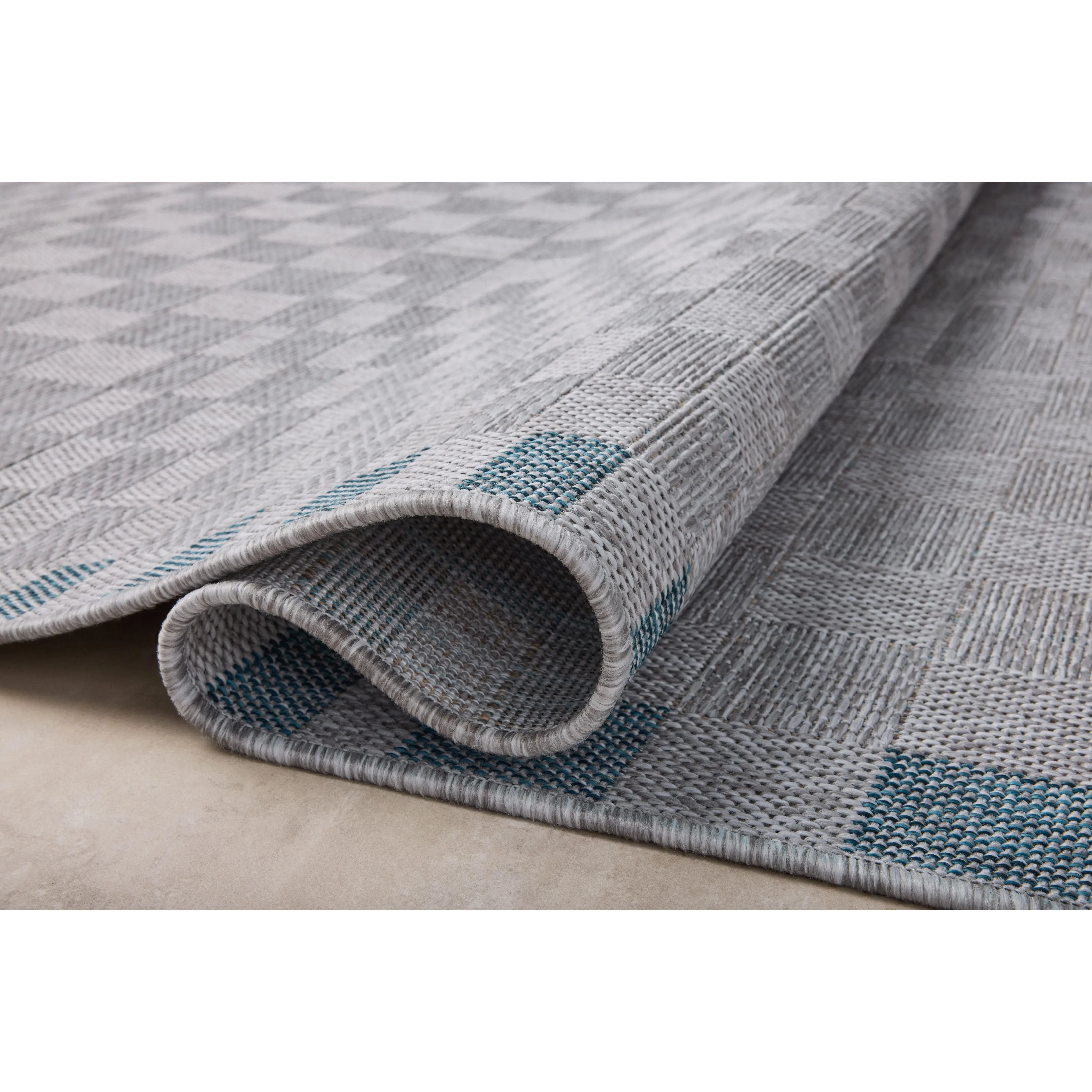 Inspired by the scenic mountain town in California, the Topanga Collection is an indoor/outdoor rug made of durable polypropylene that resembles natural fibers but is much more ready for sun, rain, and high-traffic use. Amethyst Home provides interior design, new home construction design consulting, vintage area rugs, and lighting in the Washington metro area.