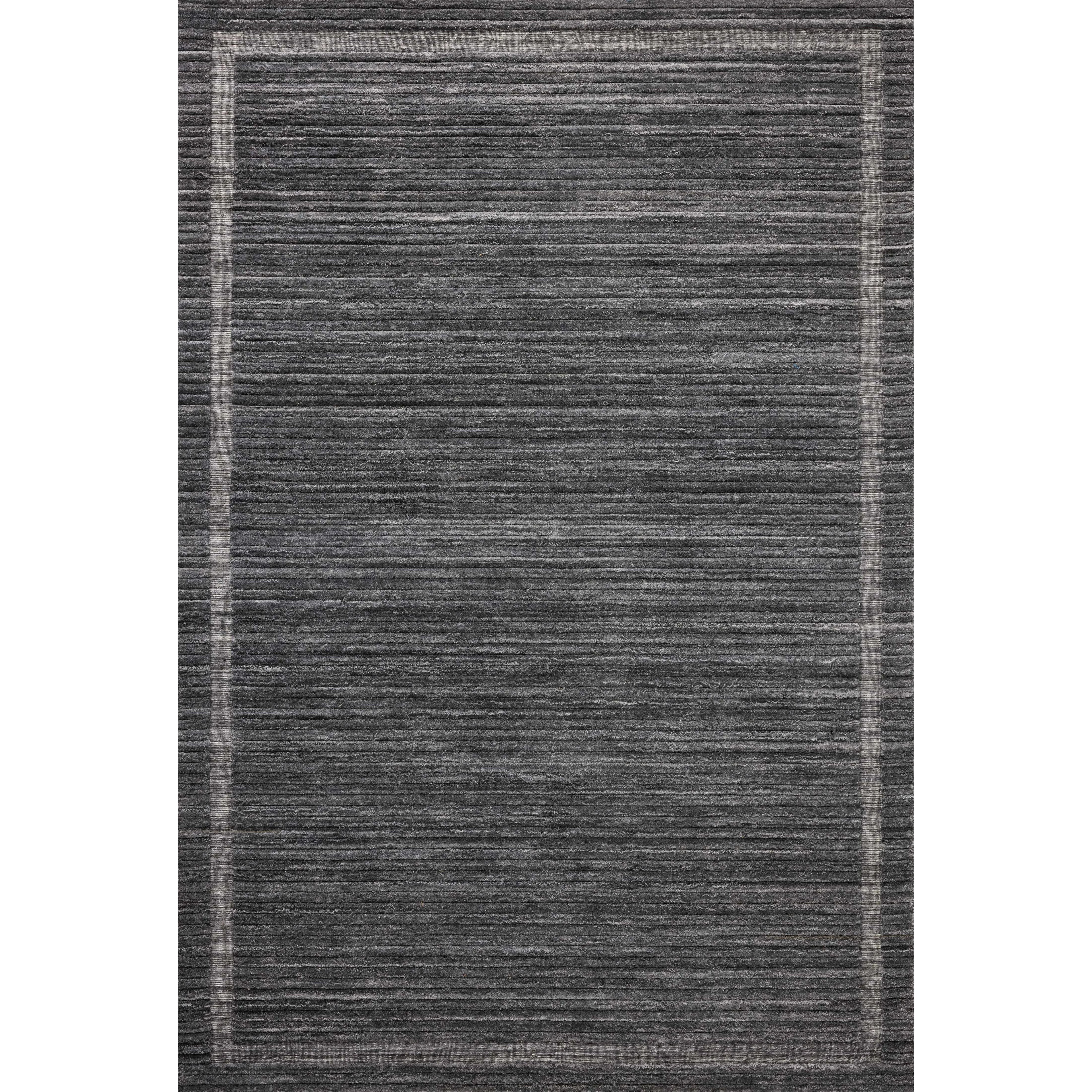 Irresistible to walk upon, the Dana Ink Rug by Brigette Romanek x Loloi has a high-low texture that alternates between a subtly shaggy pile and a soft base. Horizontal broken stripes give the area rug a fresh and energized structure, while a finish of fringe along the edges accentuates its sense of movement. Amethyst Home provides interior design, new home construction design consulting, vintage area rugs, and lighting in the San Diego metro area.