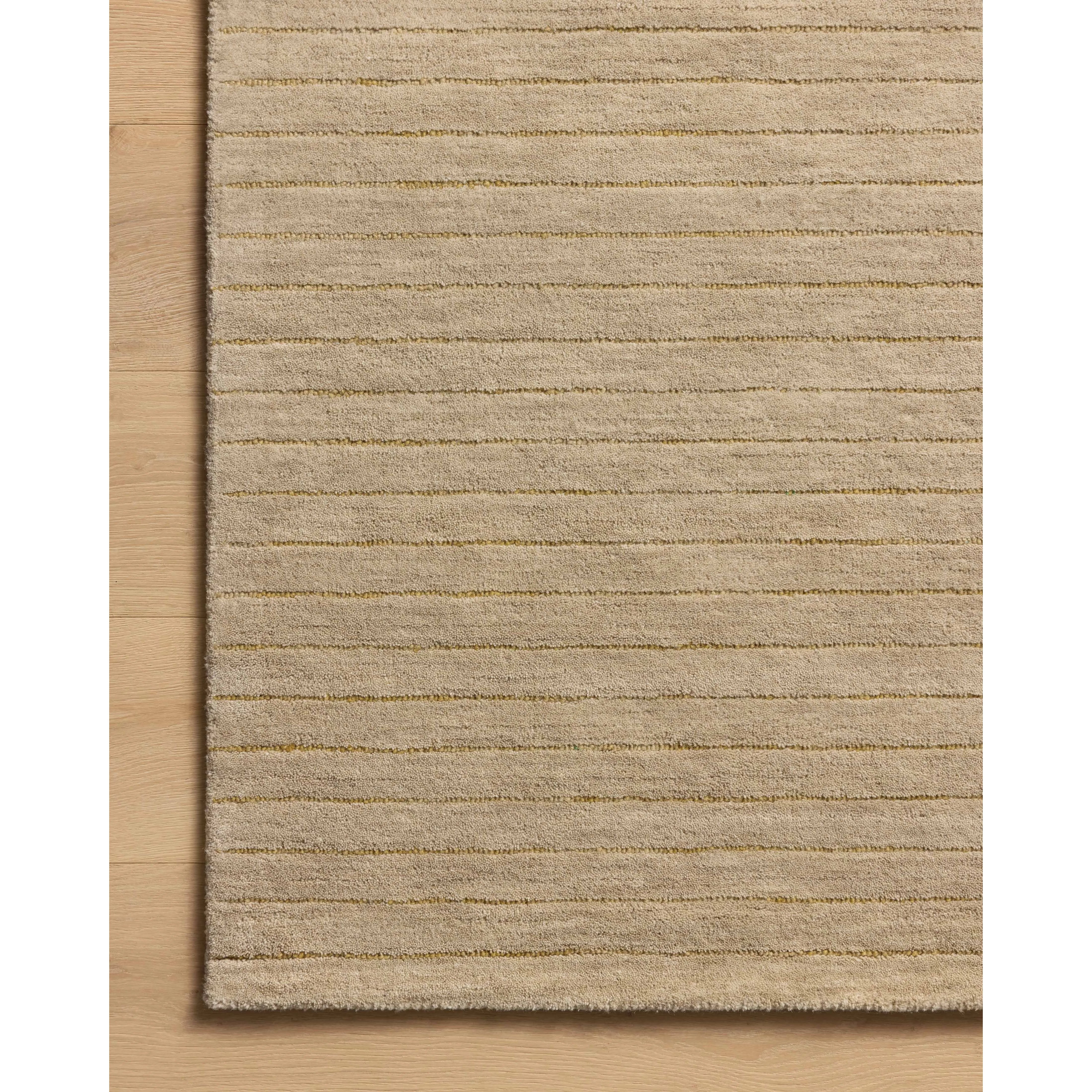 The Henry Collection from Chris Loves Julia x Loloi is a hand-tufted area rug that adds a touch of personality to a solid-colored design that can easily pair with other patterns in the room. These designs feature tufted stripes for subtle contrast and depth. The rugs wool pile is thick and satisfying to walk on, with gently nuanced color variation. Amethyst Home provides interior design, new home construction design consulting, vintage area rugs, and lighting in the Nashville metro area.