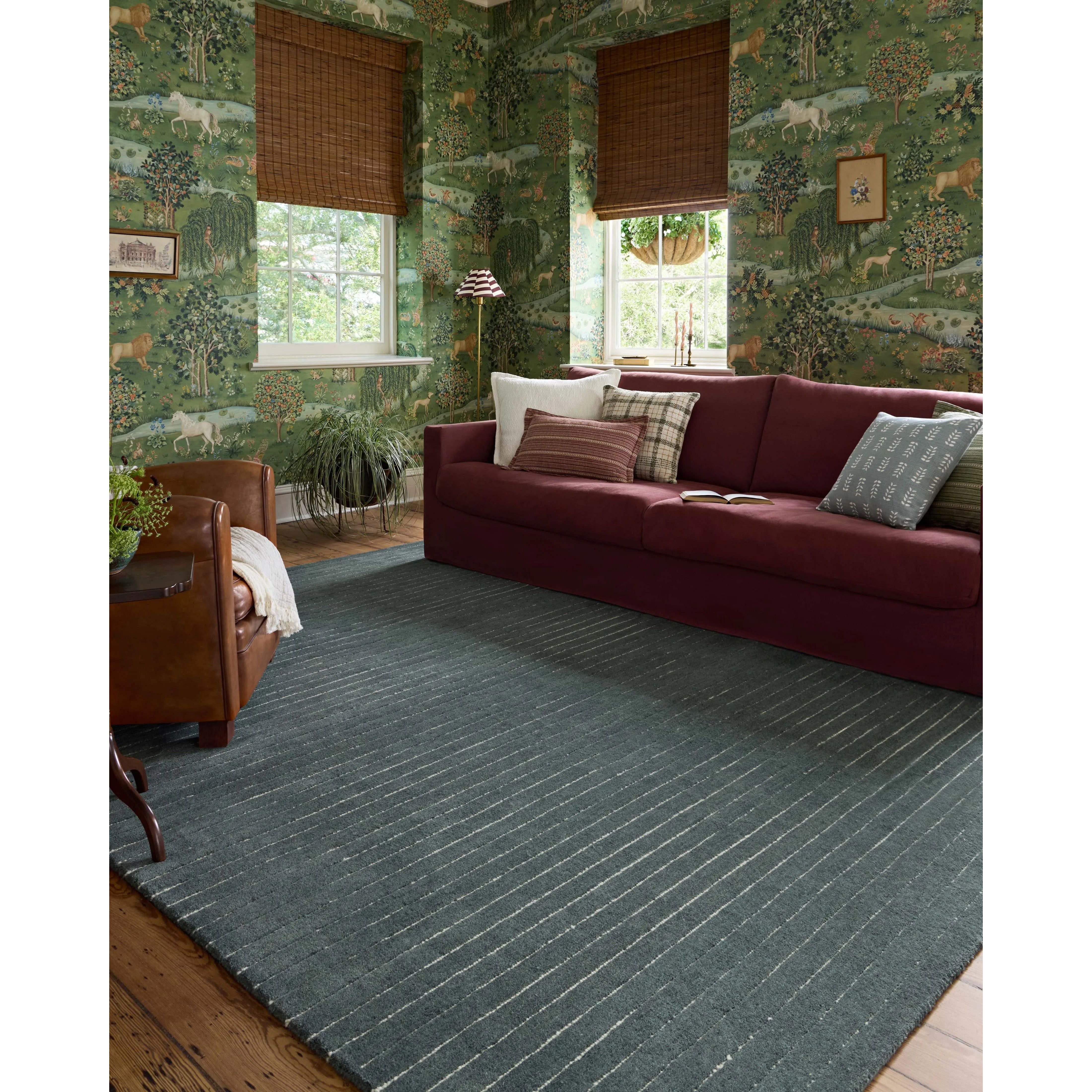 The Henry Collection from Chris Loves Julia x Loloi is a hand-tufted area rug that adds a touch of personality to a solid-colored design that can easily pair with other patterns in the room. These designs feature tufted stripes for subtle contrast and depth. The rugs wool pile is thick and satisfying to walk on, with gently nuanced color variation. Amethyst Home provides interior design, new home construction design consulting, vintage area rugs, and lighting in the Charlotte metro area.