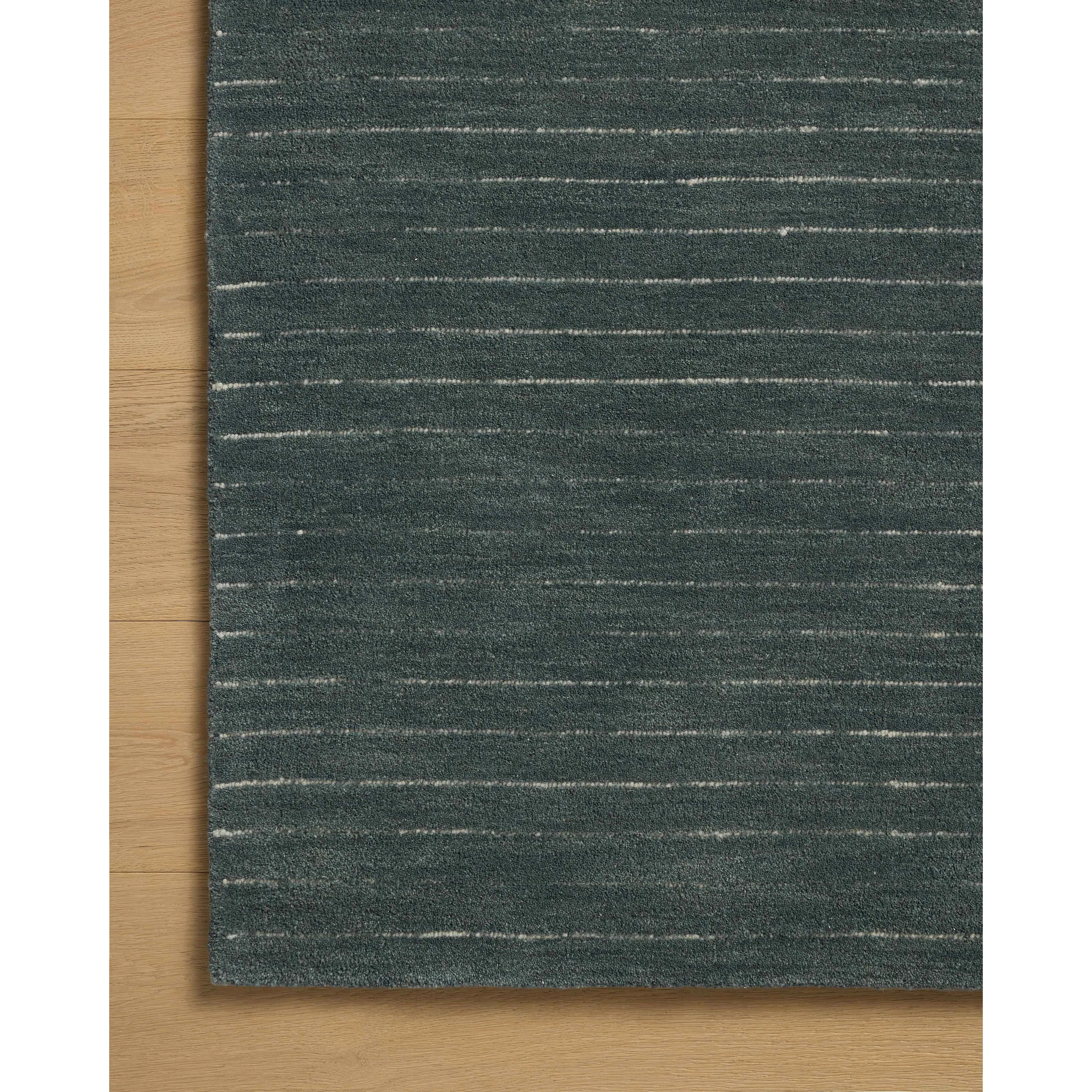 The Henry Collection from Chris Loves Julia x Loloi is a hand-tufted area rug that adds a touch of personality to a solid-colored design that can easily pair with other patterns in the room. These designs feature tufted stripes for subtle contrast and depth. The rugs wool pile is thick and satisfying to walk on, with gently nuanced color variation. Amethyst Home provides interior design, new home construction design consulting, vintage area rugs, and lighting in the Nashville metro area.