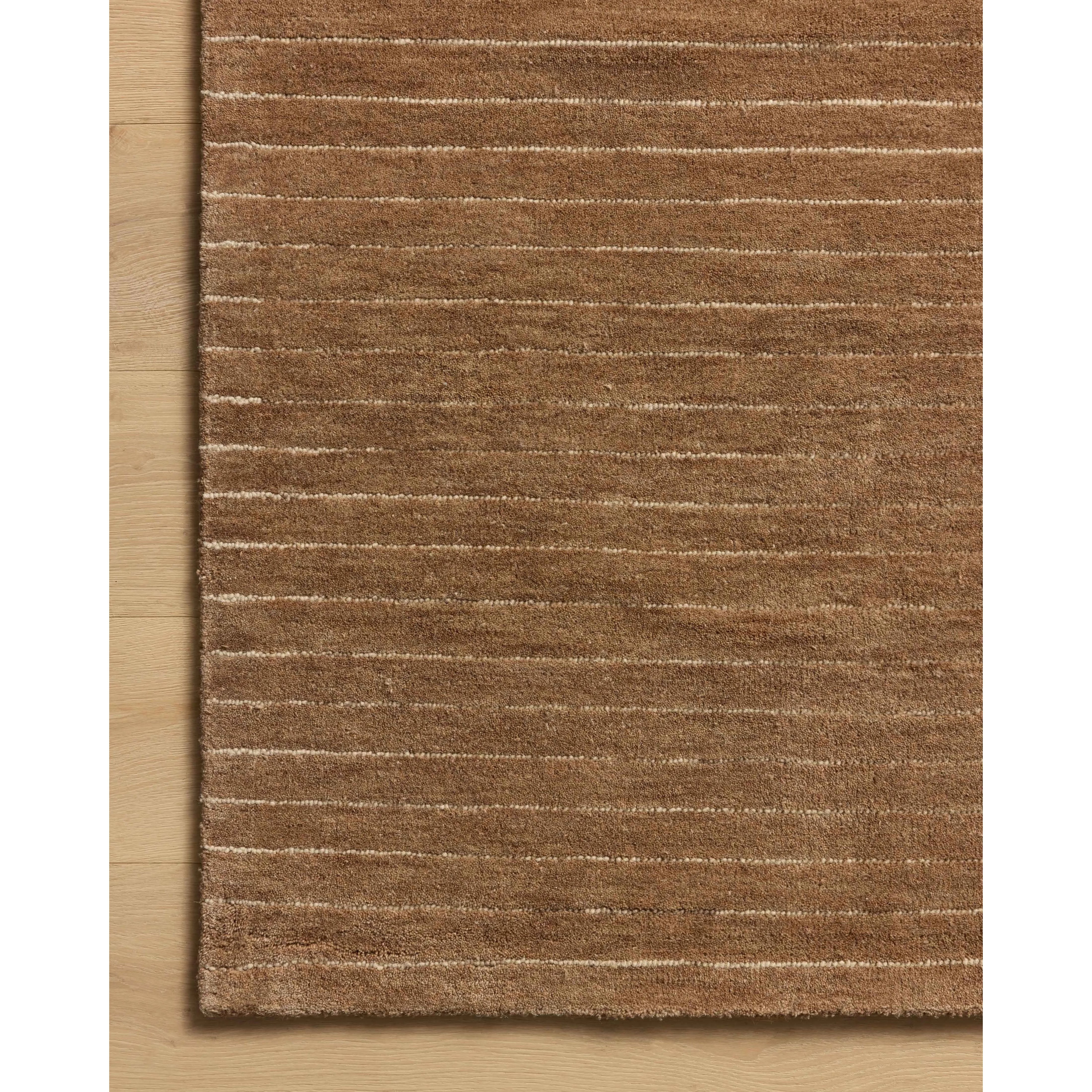The Henry Collection from Chris Loves Julia x Loloi is a hand-tufted area rug that adds a touch of personality to a solid-colored design that can easily pair with other patterns in the room. These designs feature tufted stripes for subtle contrast and depth. The rugs wool pile is thick and satisfying to walk on, with gently nuanced color variation. Amethyst Home provides interior design, new home construction design consulting, vintage area rugs, and lighting in the Scottsdale metro area.