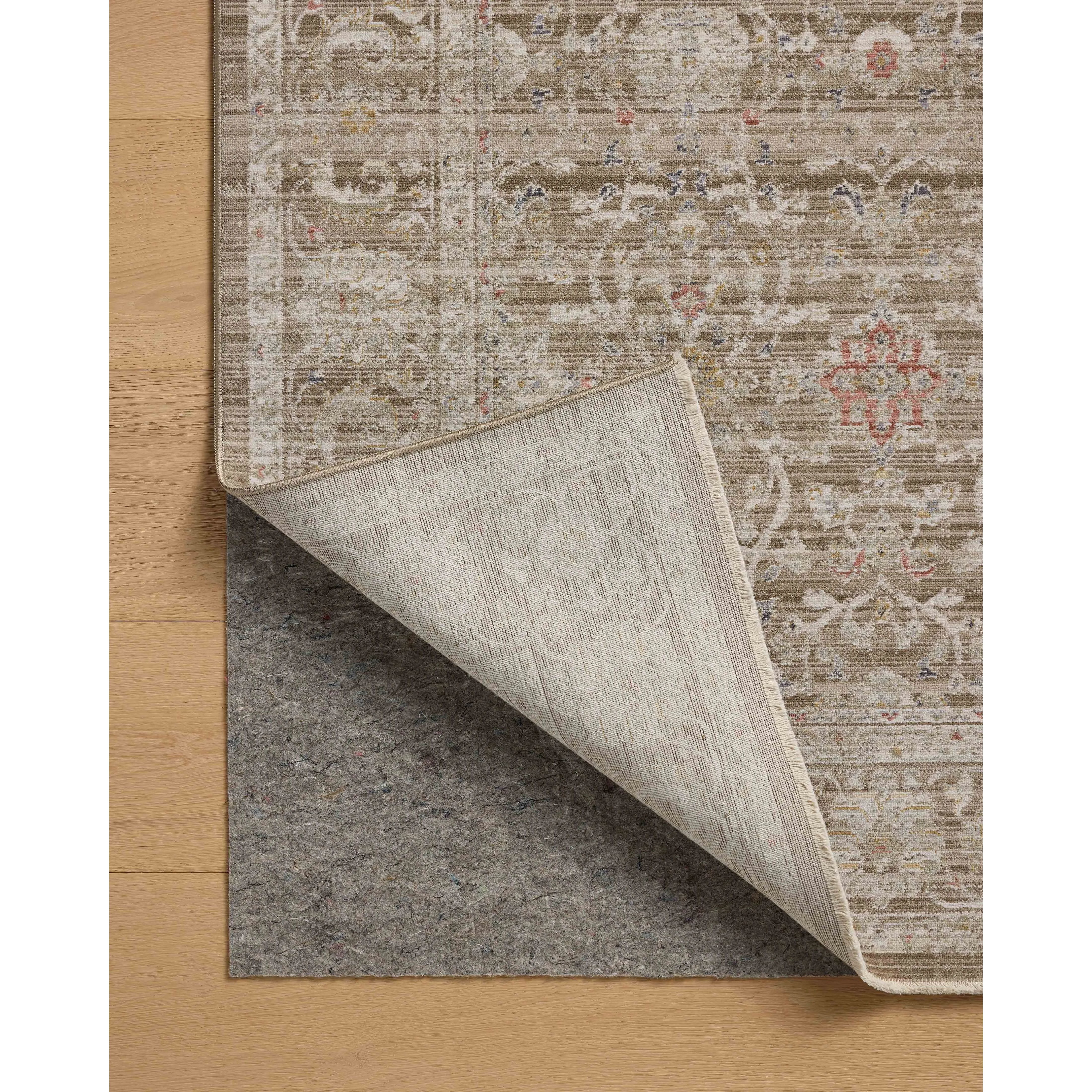 The Ida Collection from Chris Loves Julia x Loloi is a vintage-inspired area rug with a soft, subtly textured pile similar to hand-knotted rugs. The rugs gentle distressing creates a timeless look, while its durability and earthy colorways make it a great choice for the busiest rooms of the home, especially living rooms, kitchens, and hallways. Amethyst Home provides interior design, new home construction design consulting, vintage area rugs, and lighting in the Los Angeles metro area.