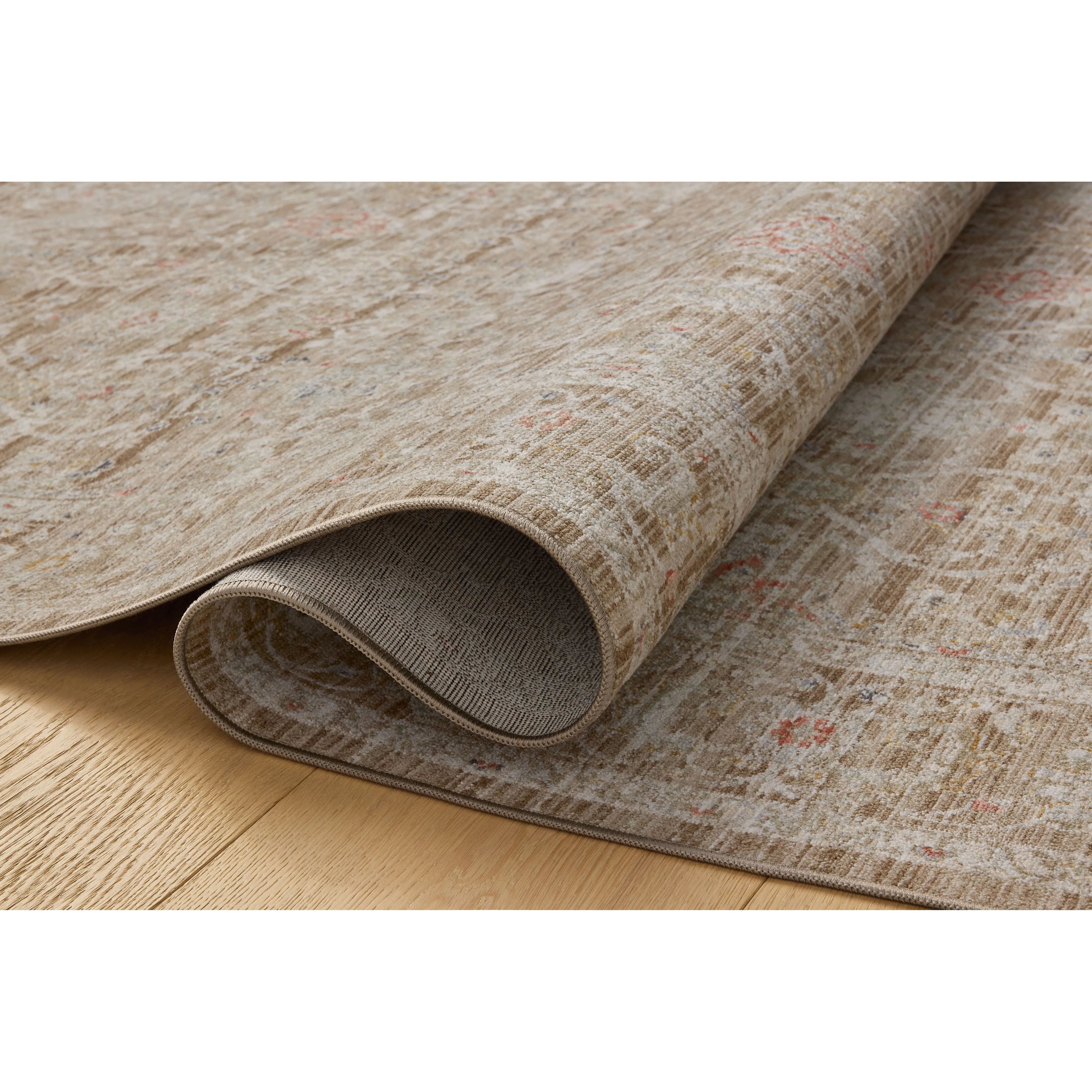 The Ida Collection from Chris Loves Julia x Loloi is a vintage-inspired area rug with a soft, subtly textured pile similar to hand-knotted rugs. The rugs gentle distressing creates a timeless look, while its durability and earthy colorways make it a great choice for the busiest rooms of the home, especially living rooms, kitchens, and hallways. Amethyst Home provides interior design, new home construction design consulting, vintage area rugs, and lighting in the Seattle metro area.