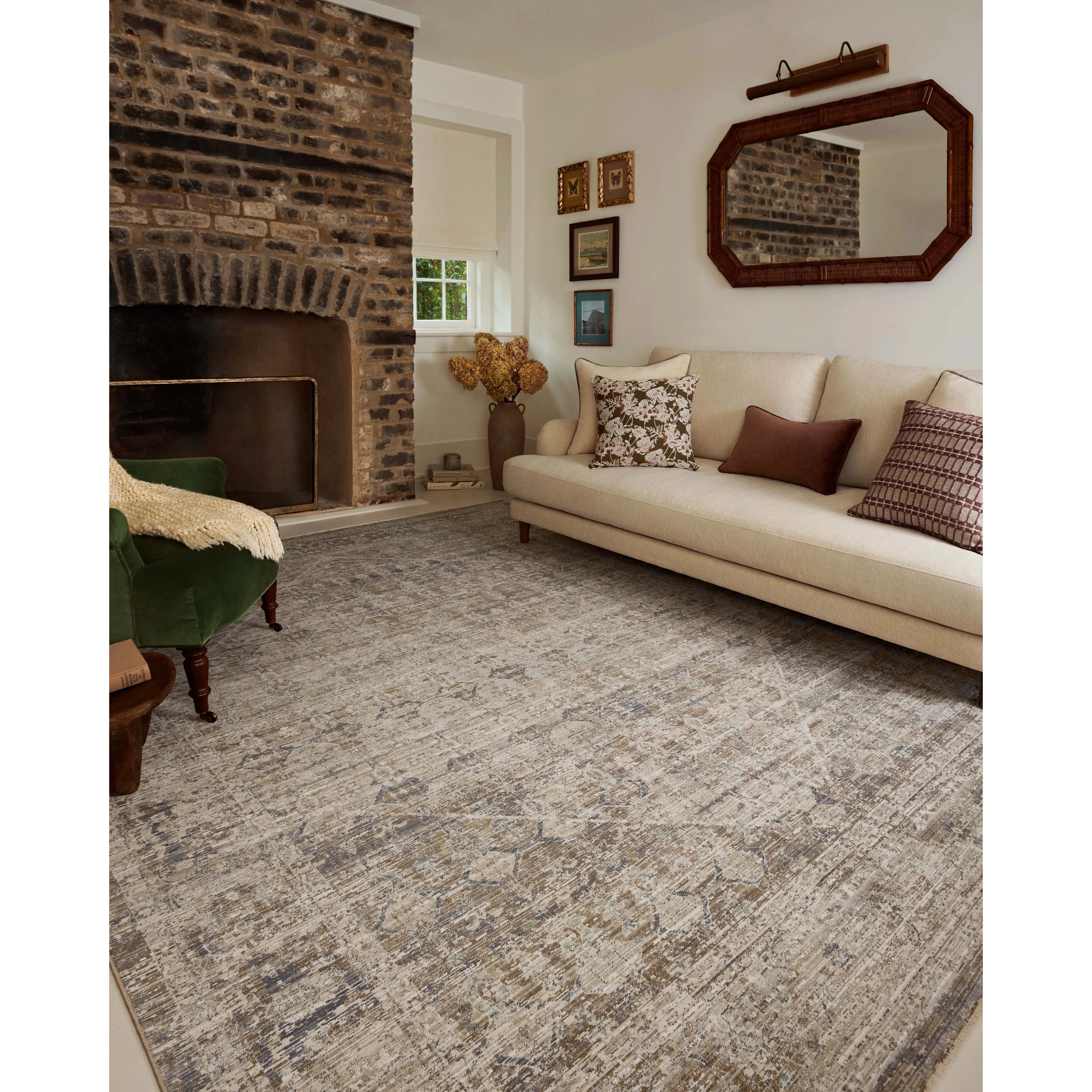 Featuring Chris Loves Julia × Loloi Ida Slate / Natural Rug by Loloi at Amethyst Home. The Ida Collection from Chris Loves Julia x Loloi is a vintage-inspired area rug with a soft, subtly textured pile similar to hand-knotted rugs. The rugs gentle distressing creates a timeless look, while its durability and earthy colorways make it a great choice for the bus. Amethyst Home provides interior design, new home construction design consulting, vintage area rugs, and lighting in the Houston metro area.