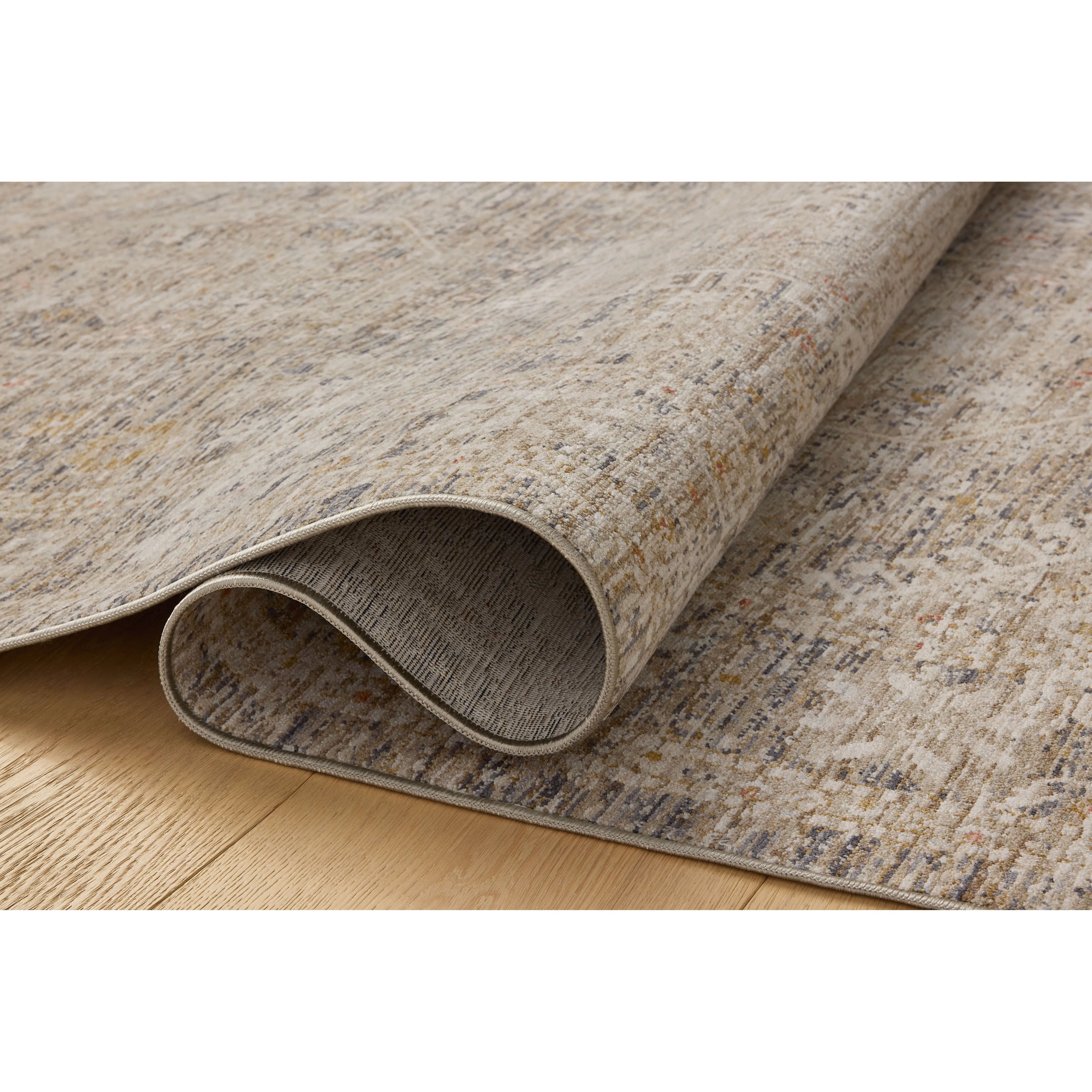 The Ida Collection from Chris Loves Julia x Loloi is a vintage-inspired area rug with a soft, subtly textured pile similar to hand-knotted rugs. The rugs gentle distressing creates a timeless look, while its durability and earthy colorways make it a great choice for the busiest rooms of the home, especially living rooms, kitchens, and hallways. Amethyst Home provides interior design, new home construction design consulting, vintage area rugs, and lighting in the Los Angeles metro area.
