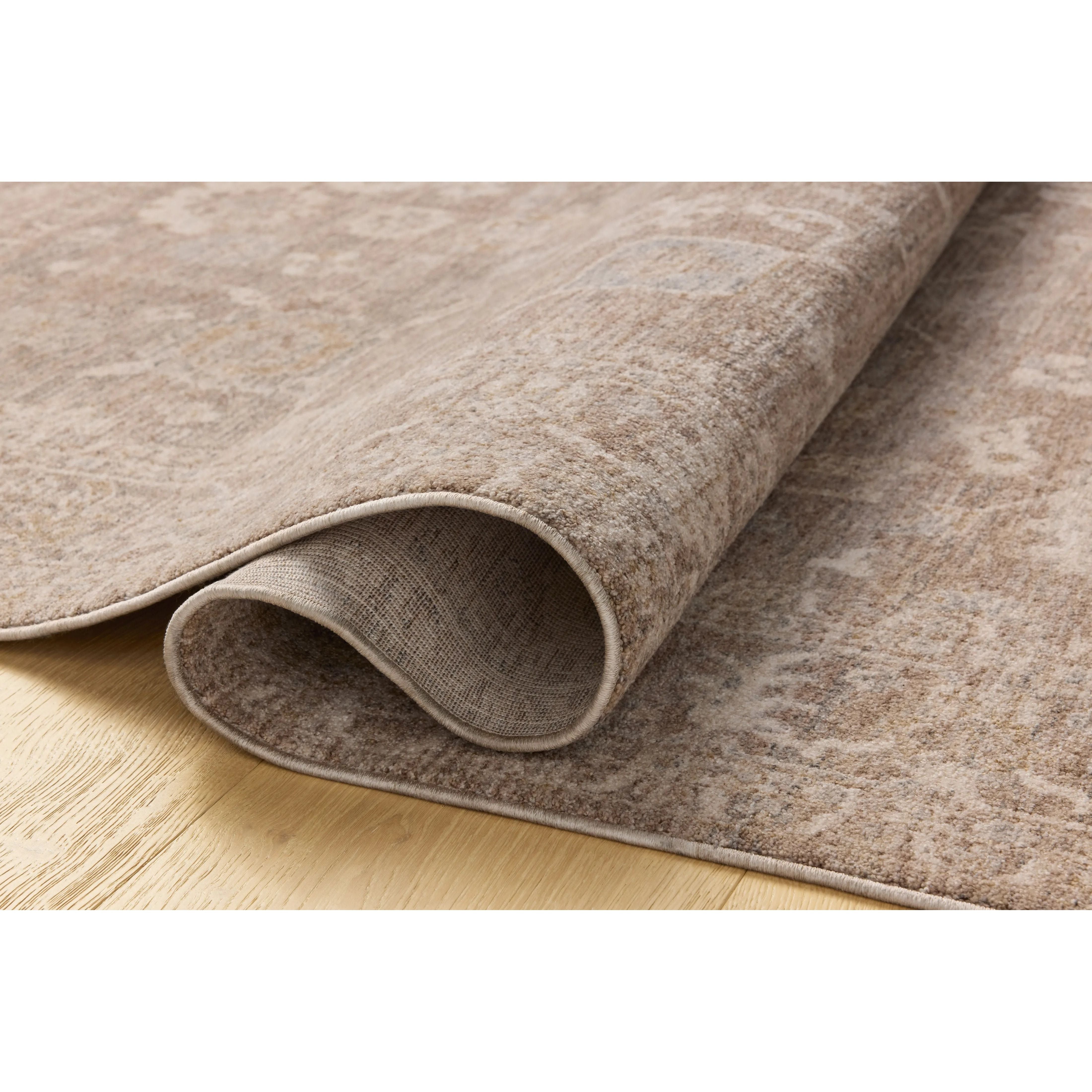 The Louisa Collection is a serene area rug based on beautiful, traditional Turkish designs updated in calm colorways by Chris Loves Julia in collaboration with Loloi. Pale blues, creams, and browns create a sense of softness, but so does the rugs pile, which is made of easy-to-clean, velvety polyester. Amethyst Home provides interior design, new home construction design consulting, vintage area rugs, and lighting in the Washington metro area.