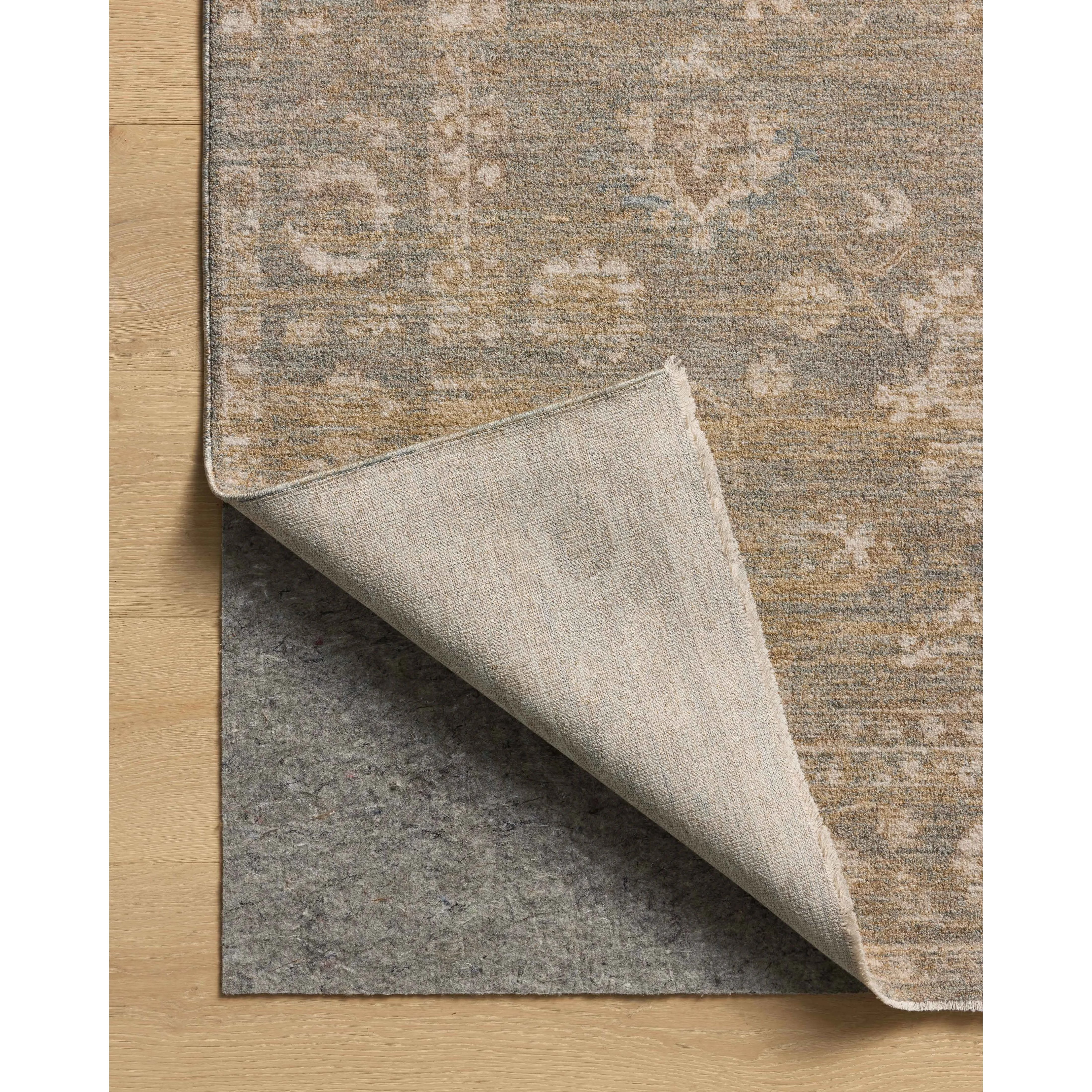 The Louisa Collection is a serene area rug based on beautiful, traditional Turkish designs updated in calm colorways by Chris Loves Julia in collaboration with Loloi. Pale blues, creams, and browns create a sense of softness, but so does the rugs pile, which is made of easy-to-clean, velvety polyester. Amethyst Home provides interior design, new home construction design consulting, vintage area rugs, and lighting in the Alpharetta metro area.